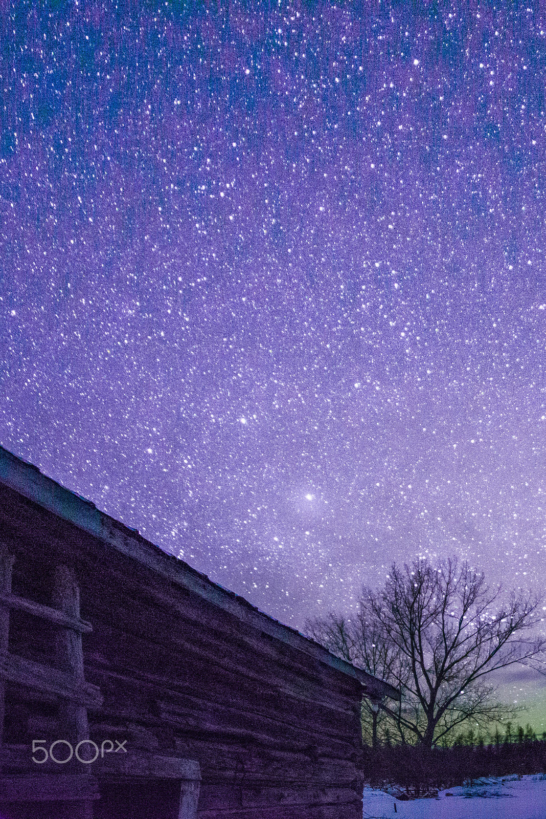 Samyang 14mm F2.8 ED AS IF UMC sample photo. Rural log cabin barn at night with stars and milky way photography