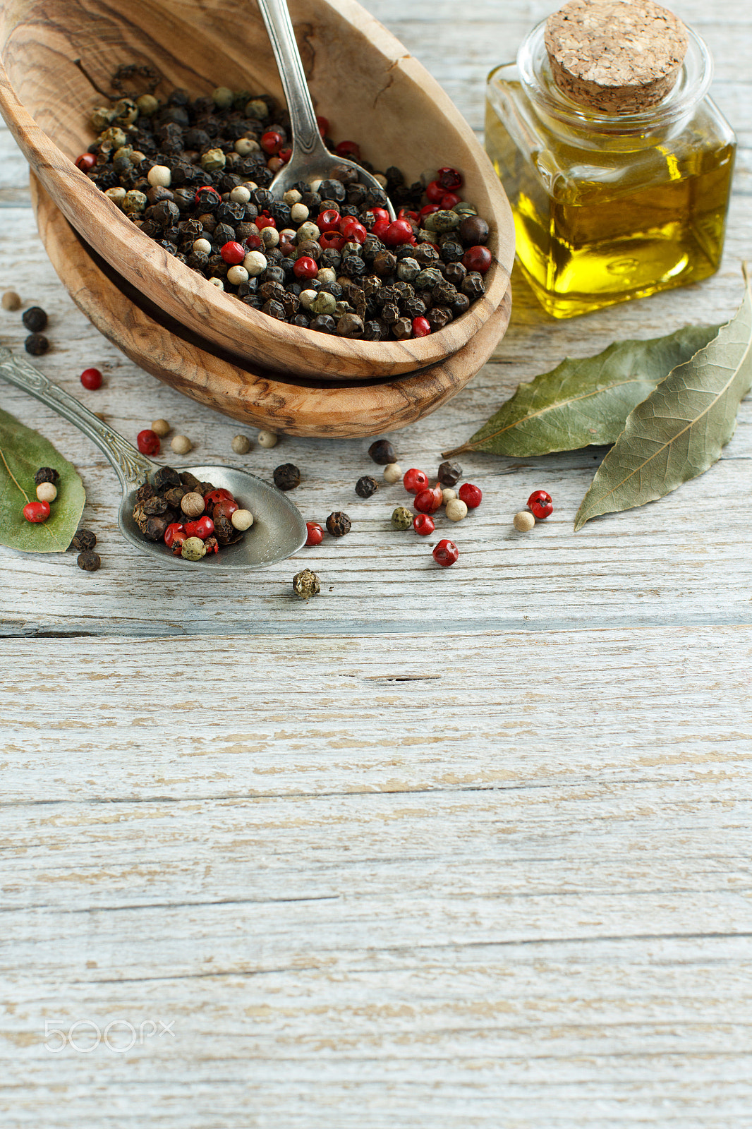 Canon EOS 650D (EOS Rebel T4i / EOS Kiss X6i) + Canon EF 50mm F1.2L USM sample photo. Peppercorn mix in a bowl, bay leaves  and olive oil photography