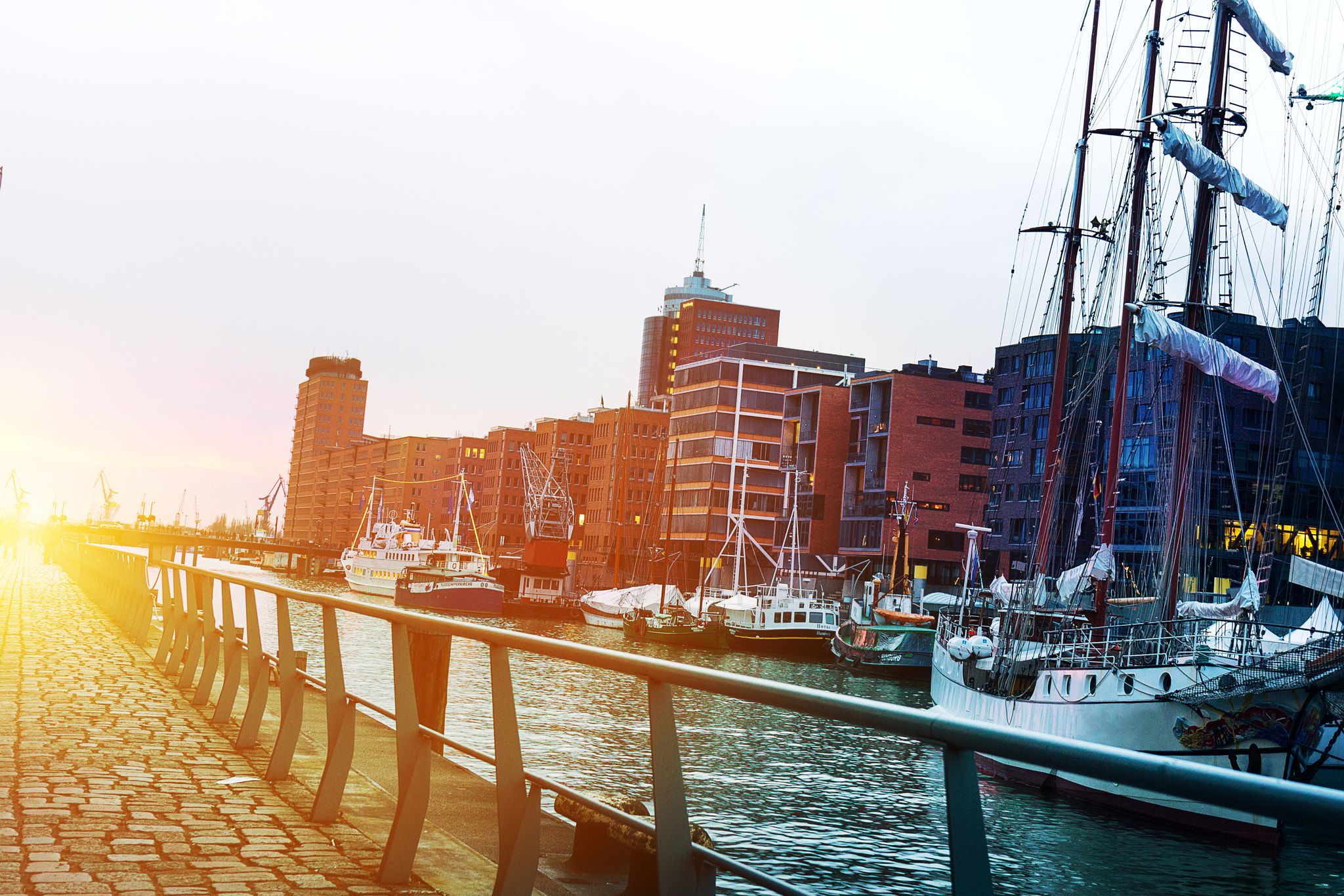 Canon EF 24-70mm F4L IS USM sample photo. Beautiful picture of sunset in port city with water, ships and b photography