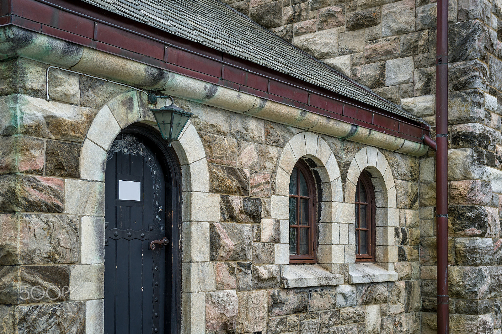 Nikon AF-S Nikkor 24-70mm F2.8G ED sample photo. Stone wall of medieval stone church, alesund, norway. photography