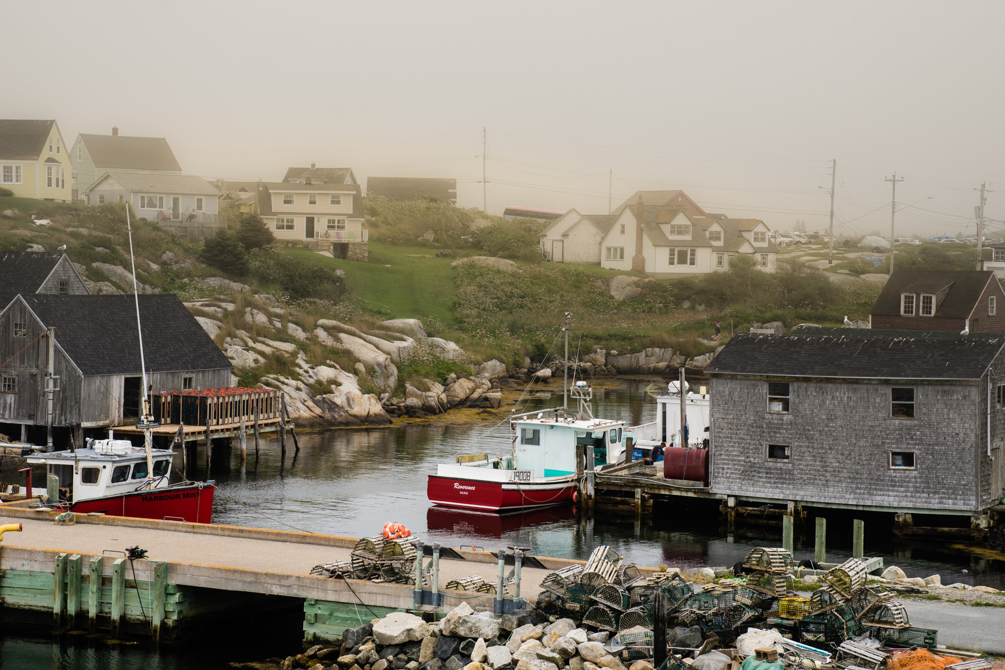 Sony ILCA-77M2 sample photo. Lifting fog on peggys cove photography