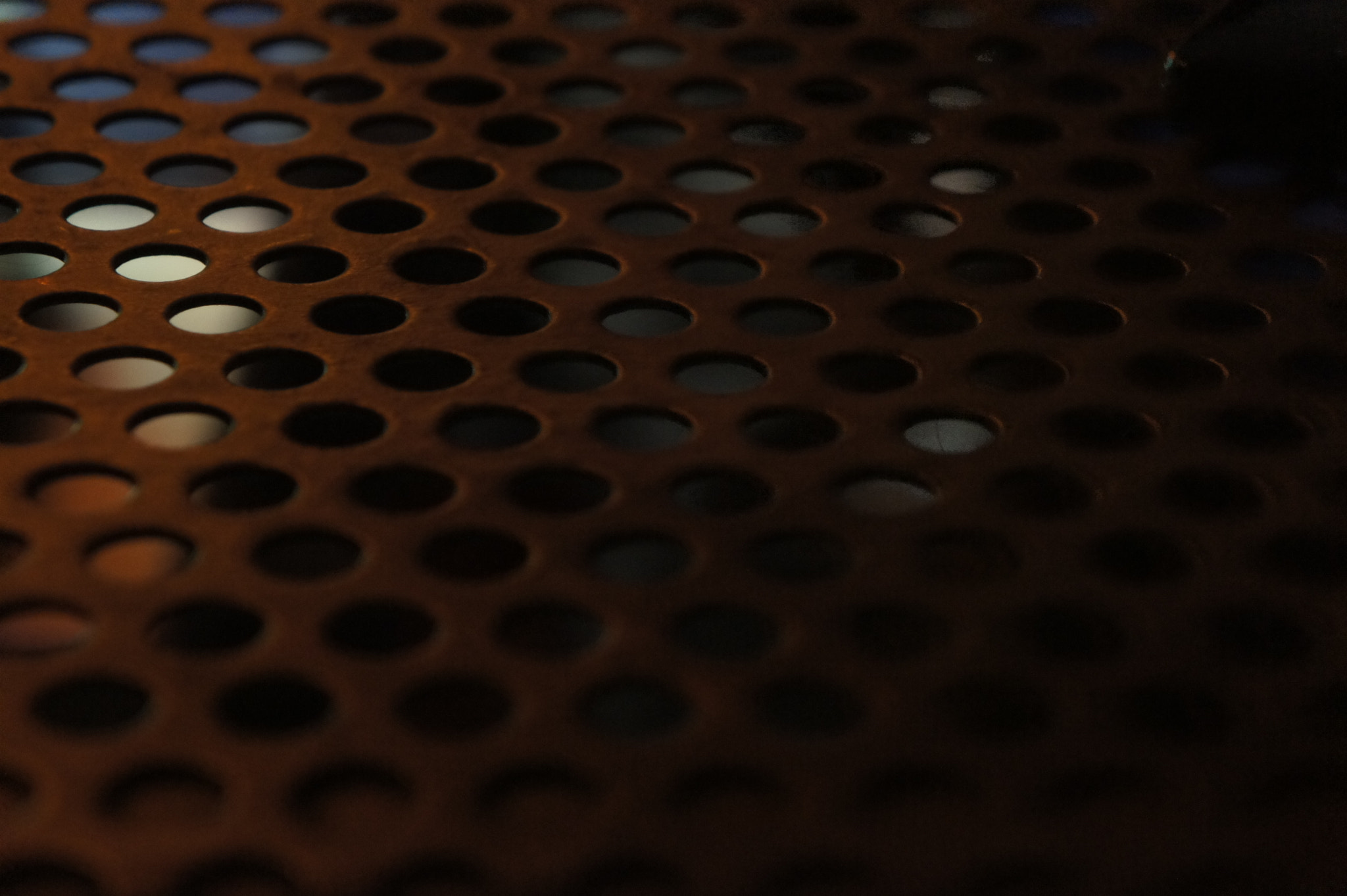Sony E 18-55mm F3.5-5.6 OSS sample photo. Metallic holes photography