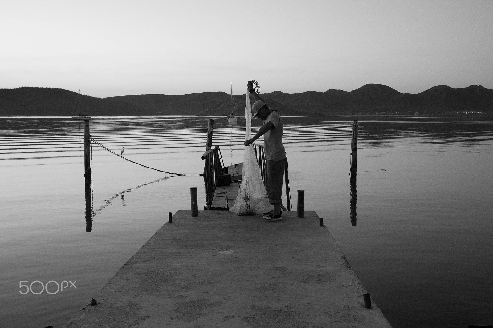 Canon EF-S 18-135mm F3.5-5.6 IS sample photo. Fisherman photography