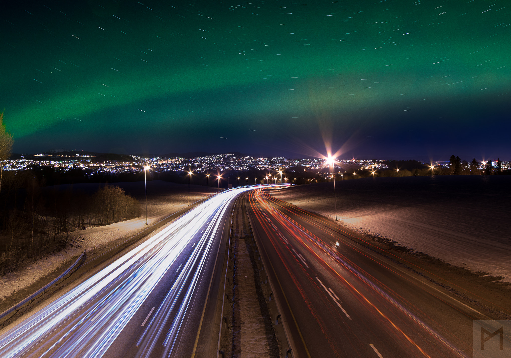 Samyang 14mm F2.8 ED AS IF UMC sample photo. A green sky above the highway photography