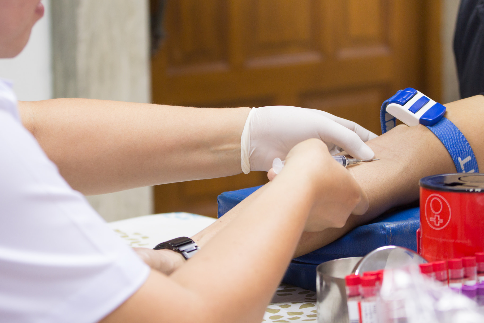 Canon EOS 60D + Canon EF 70-200mm F4L IS USM sample photo. Nurse collecting blood samples from patient for analysis on the photography