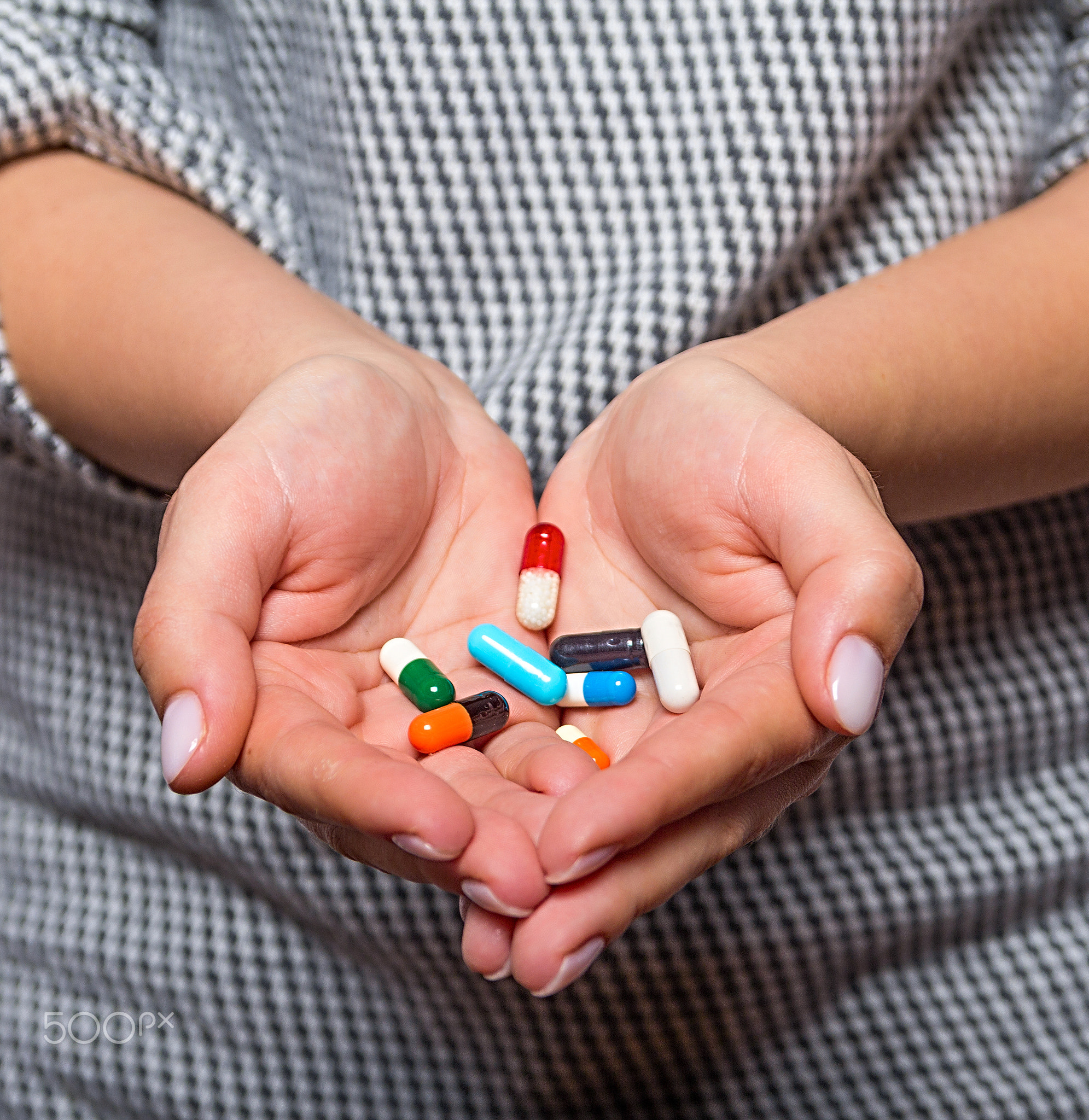 pills in the hands of women