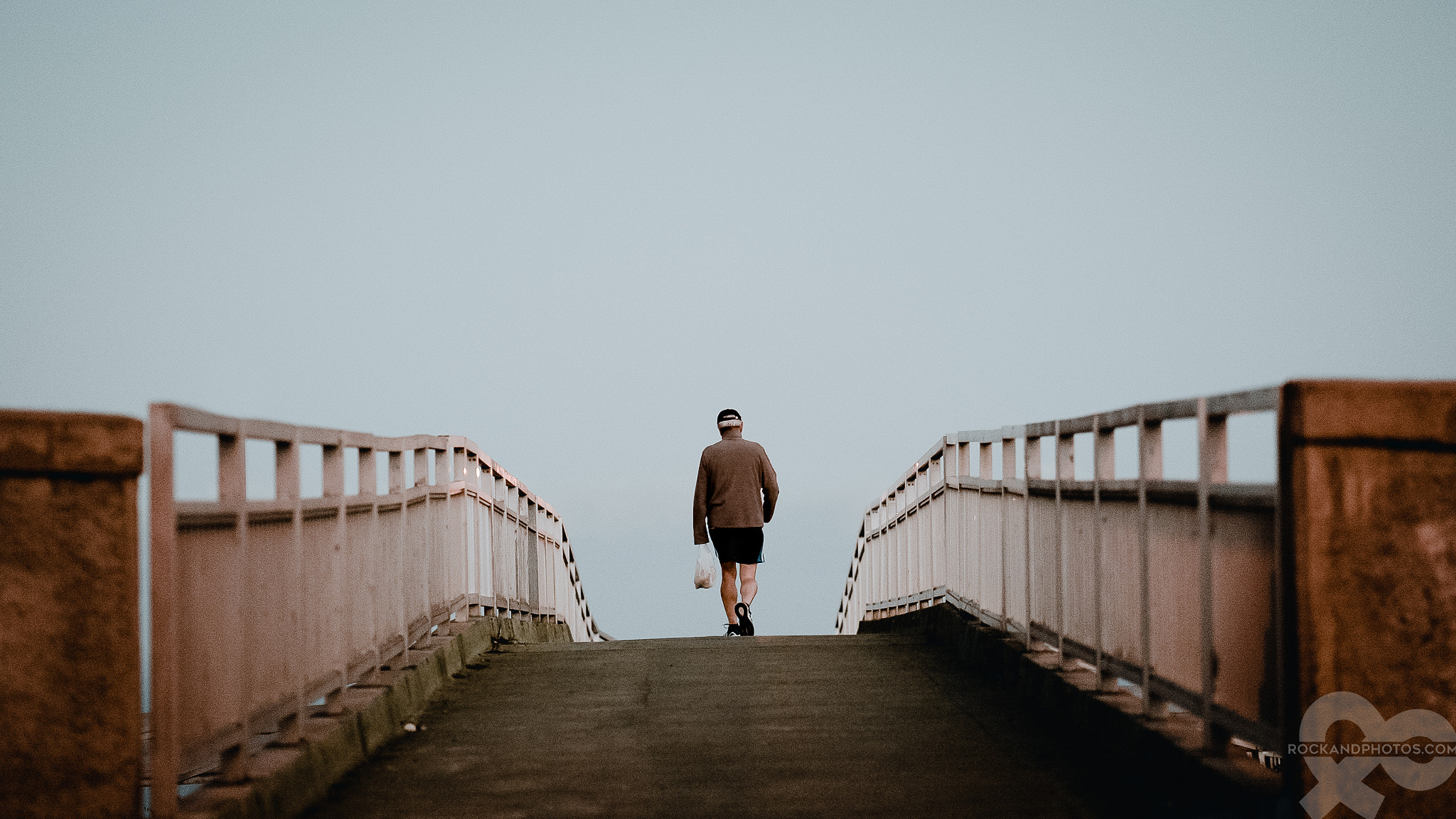 ZEISS Batis 85mm F1.8 sample photo. · the man / the bridge · photography