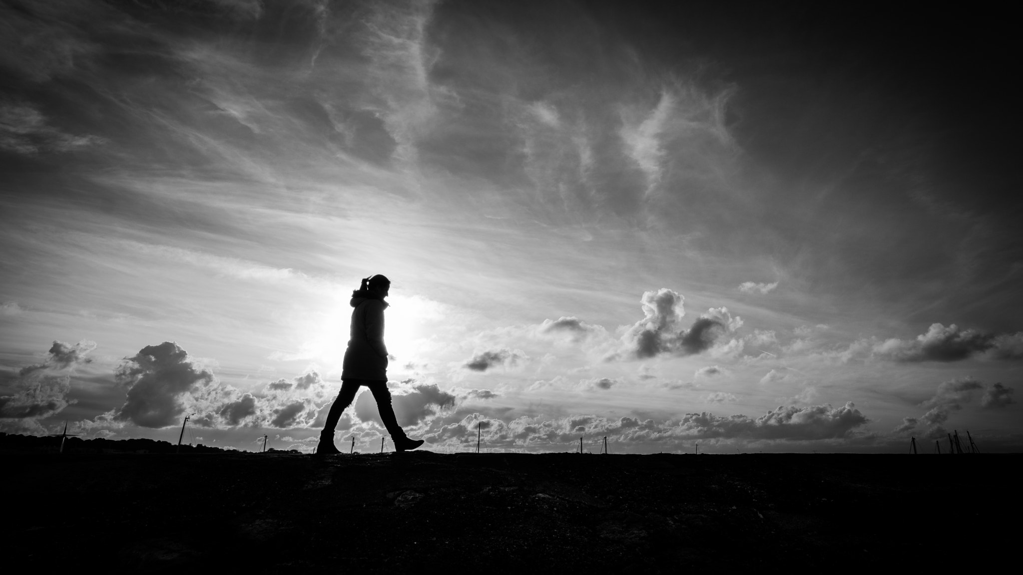 Fujifilm X-Pro2 + Fujifilm XF 14mm F2.8 R sample photo. Walking alone - howth, ireland - black and white street photography photography