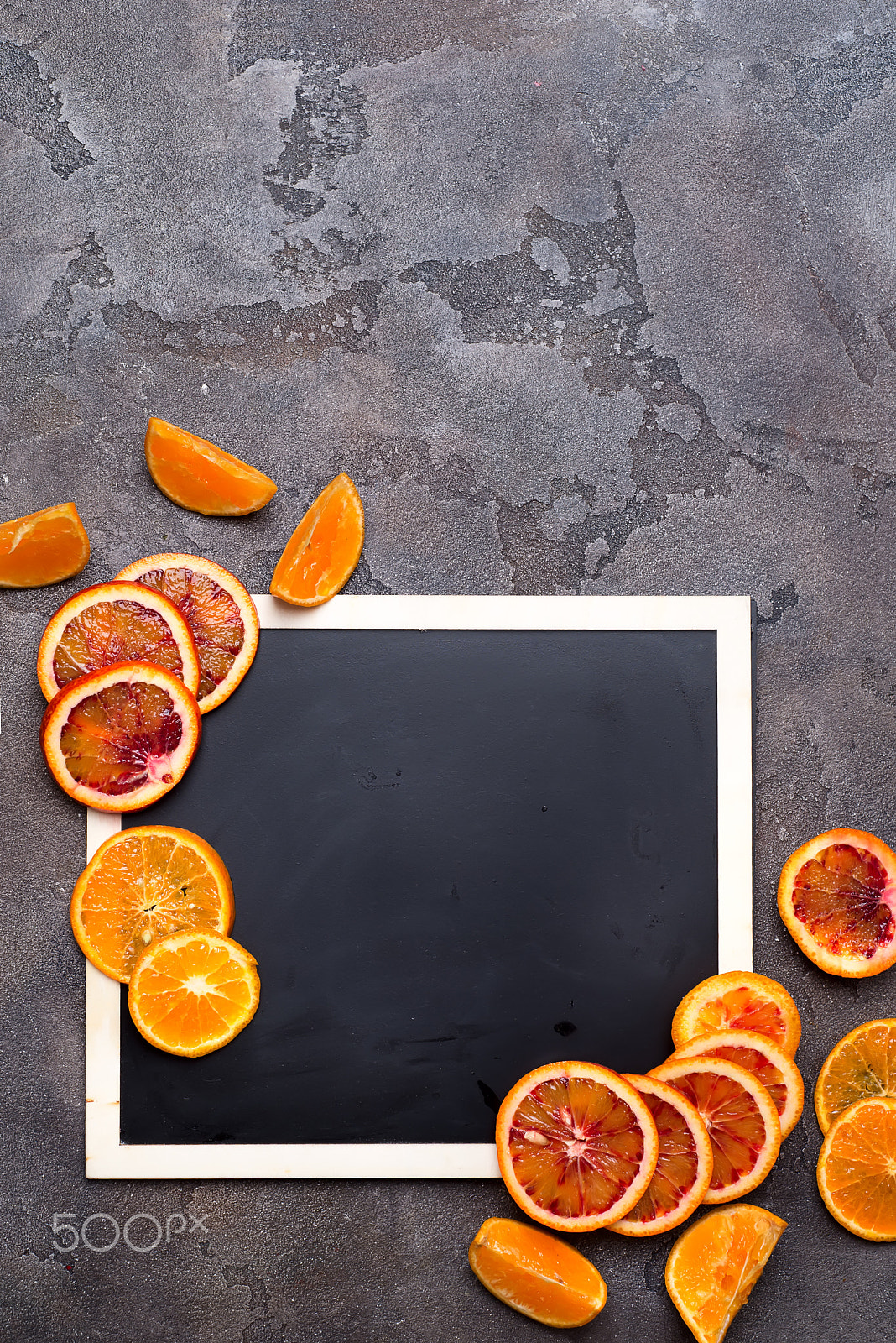 Nikon D610 + AF Nikkor 50mm f/1.8 sample photo. Orange rings on a black chalkboard. photography