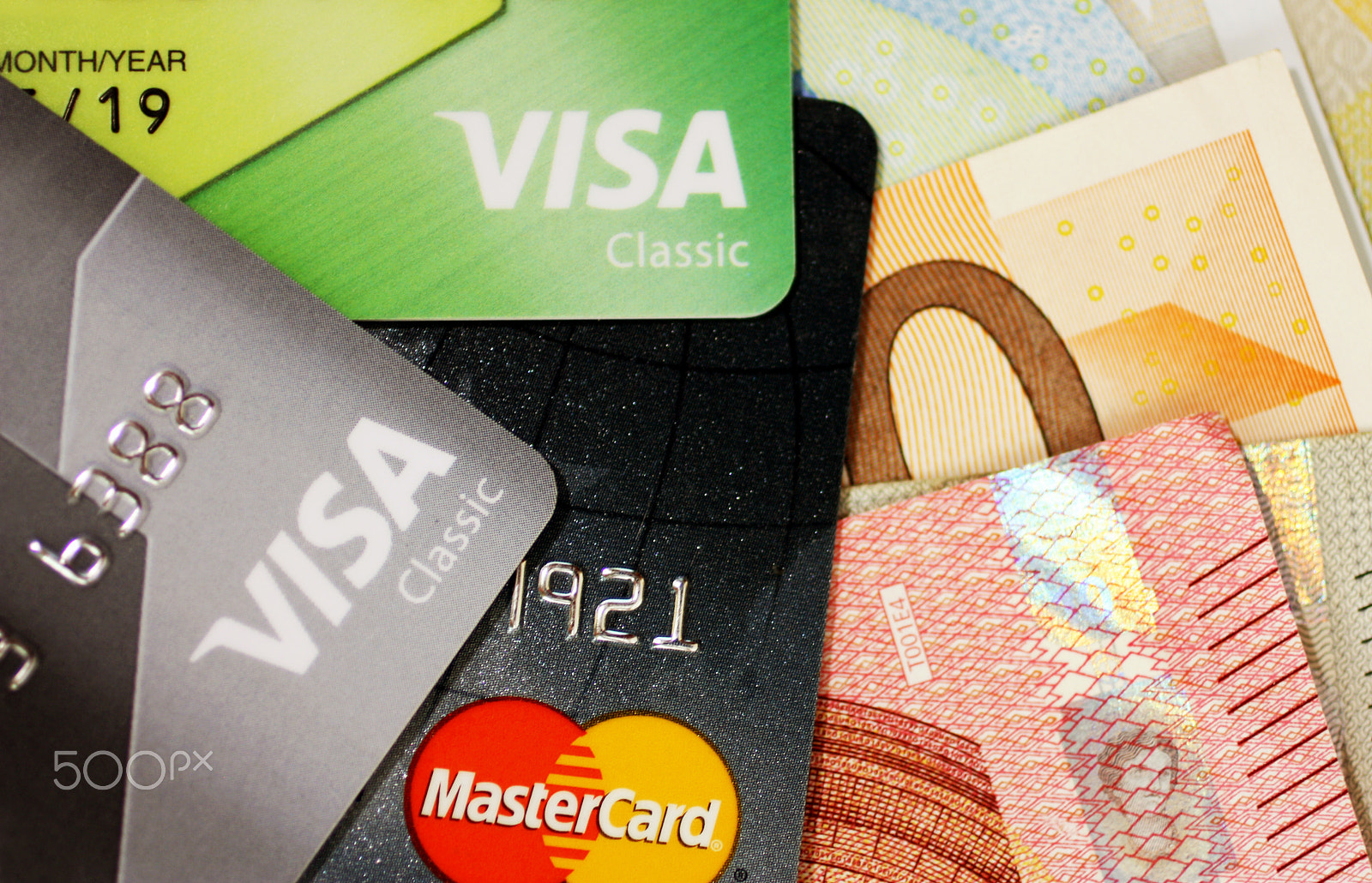 Canon EF 50mm F2.5 Macro sample photo. Set of colorful credit cards on the monetary background. photography
