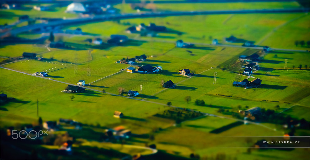 Sony a99 II + Minolta AF 80-200mm F2.8 HS-APO G sample photo. Miniature tilt-shift aerial view of the village in alps photography