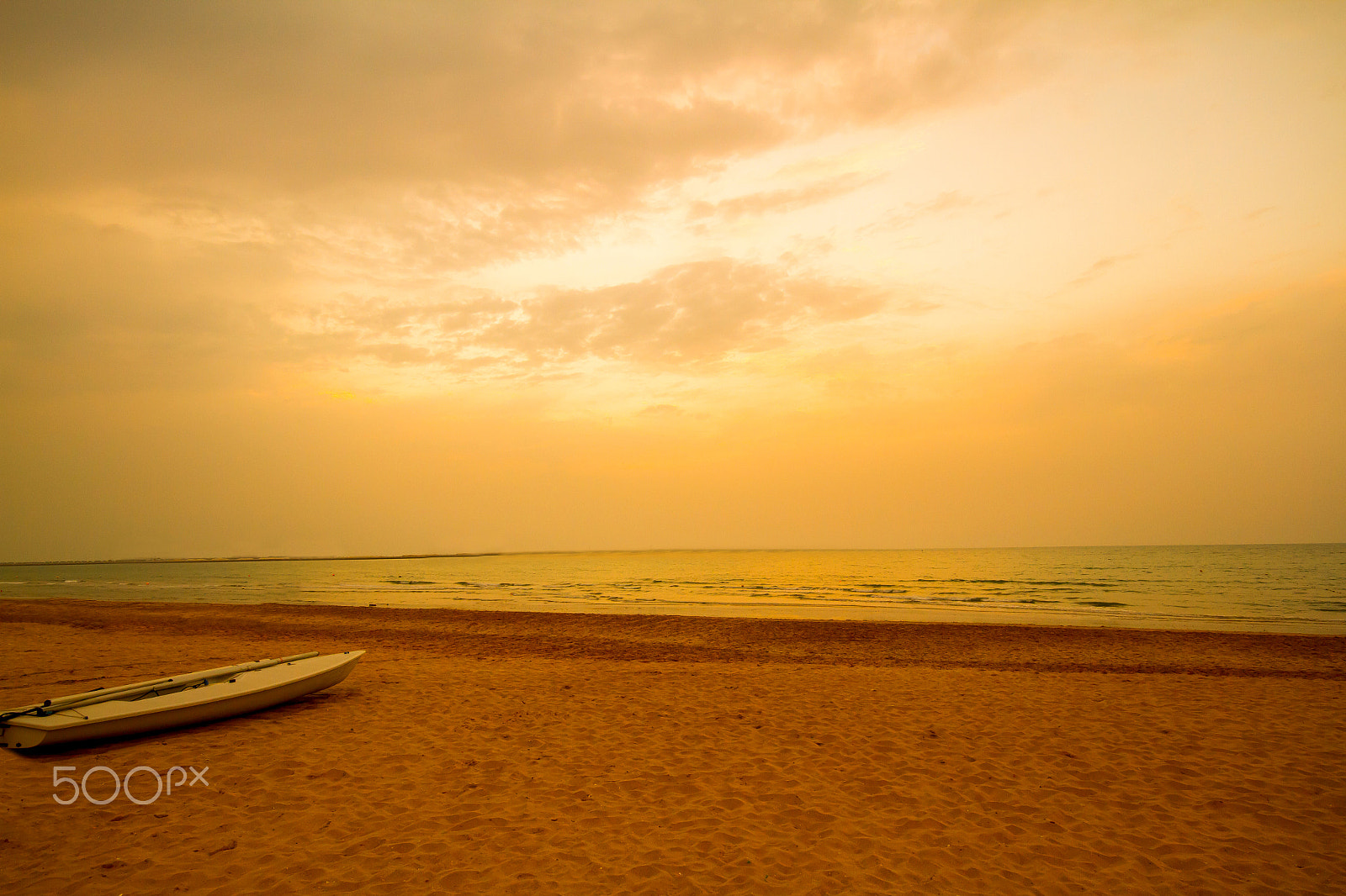 Canon EOS 7D + Sigma 10-20mm F4-5.6 EX DC HSM sample photo. Beautiful evening with golden sunset in a beach at ras al khaima, uae photography