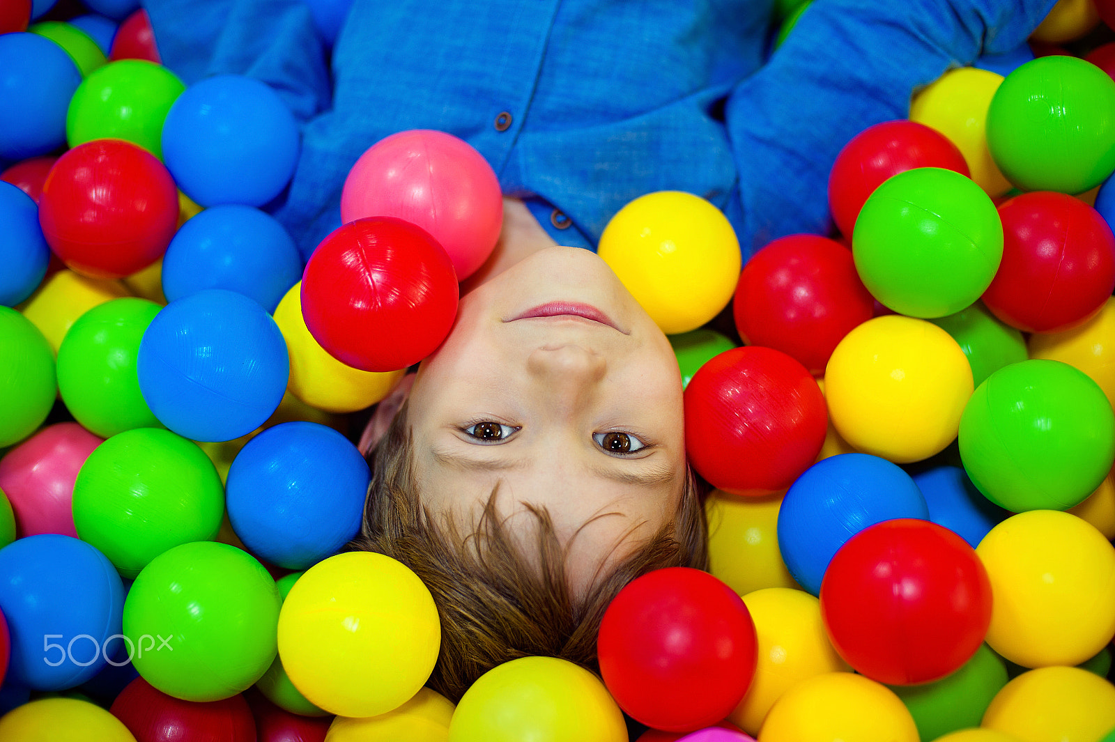 Nikon D700 + Nikon AF Nikkor 50mm F1.4D sample photo. Happy little kid boy playing at colorful plastic balls playground high view. funny child having... photography