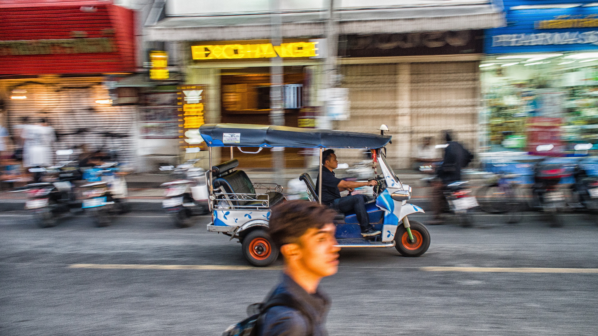 Olympus OM-D E-M5 sample photo. Tuk-tuk blazing past photography