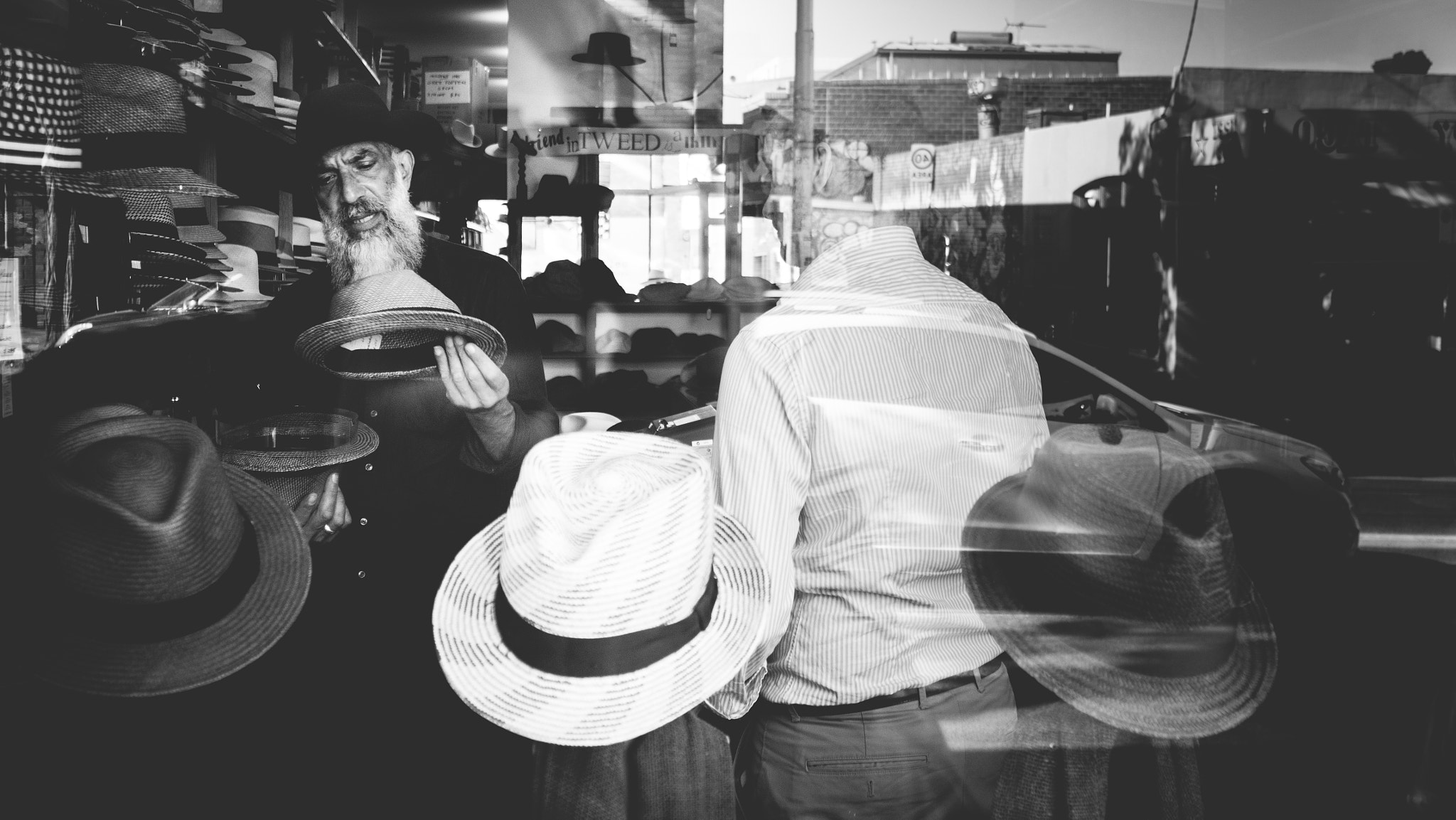 Olympus OM-D E-M5 sample photo. Melbourne hat shop salesman photography