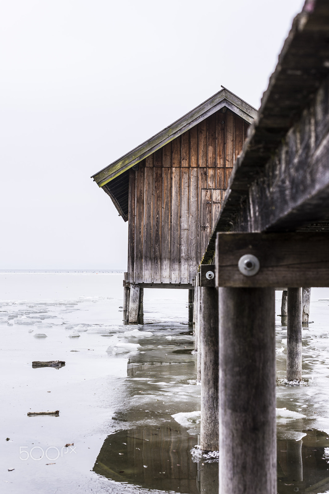 Nikon AF-S DX Micro Nikkor 40mm F2.8 sample photo. Boat house on a frozen lake photography