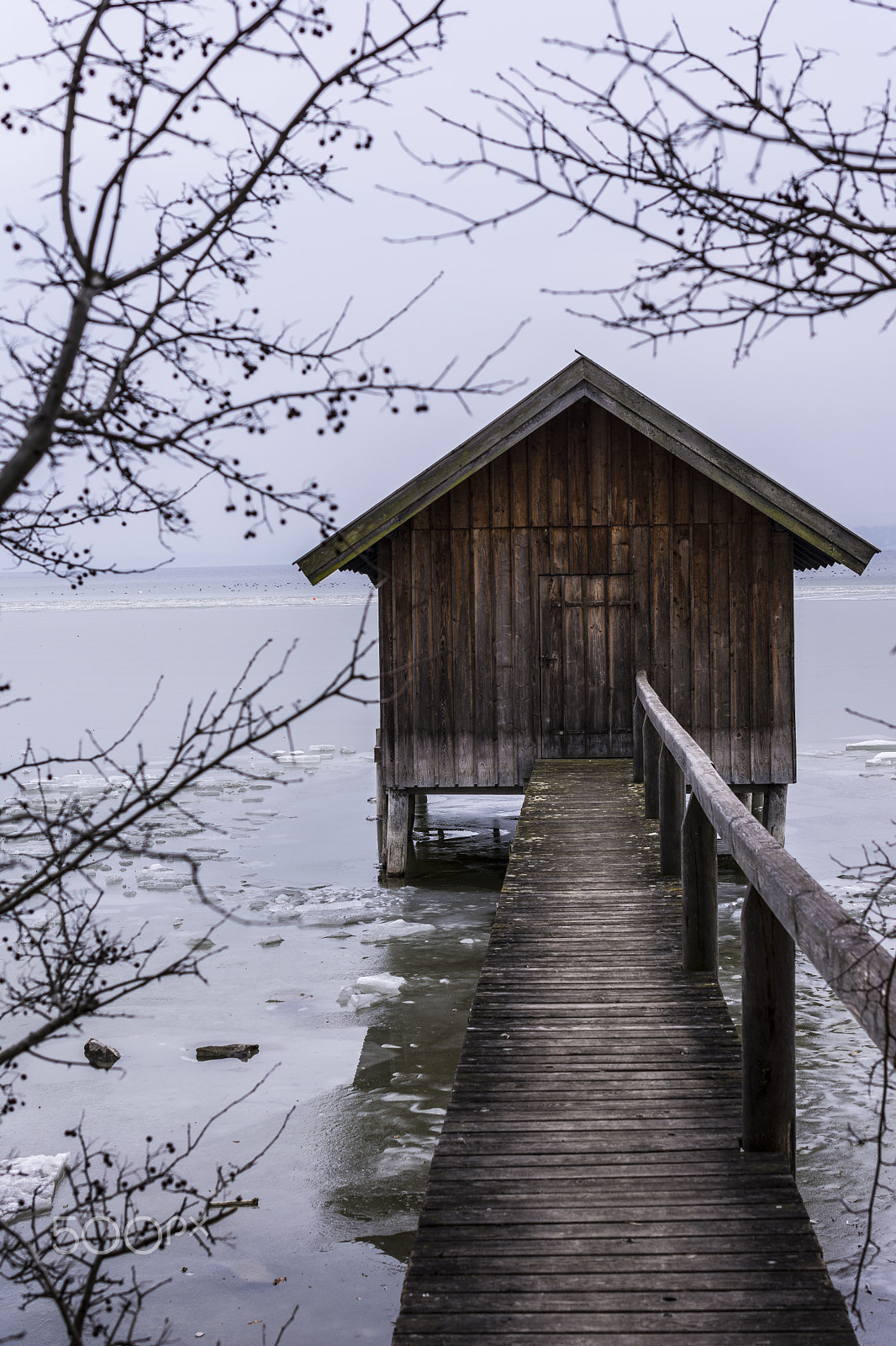 Nikon AF-S DX Micro Nikkor 40mm F2.8 sample photo. Boat house on a frozen lake photography