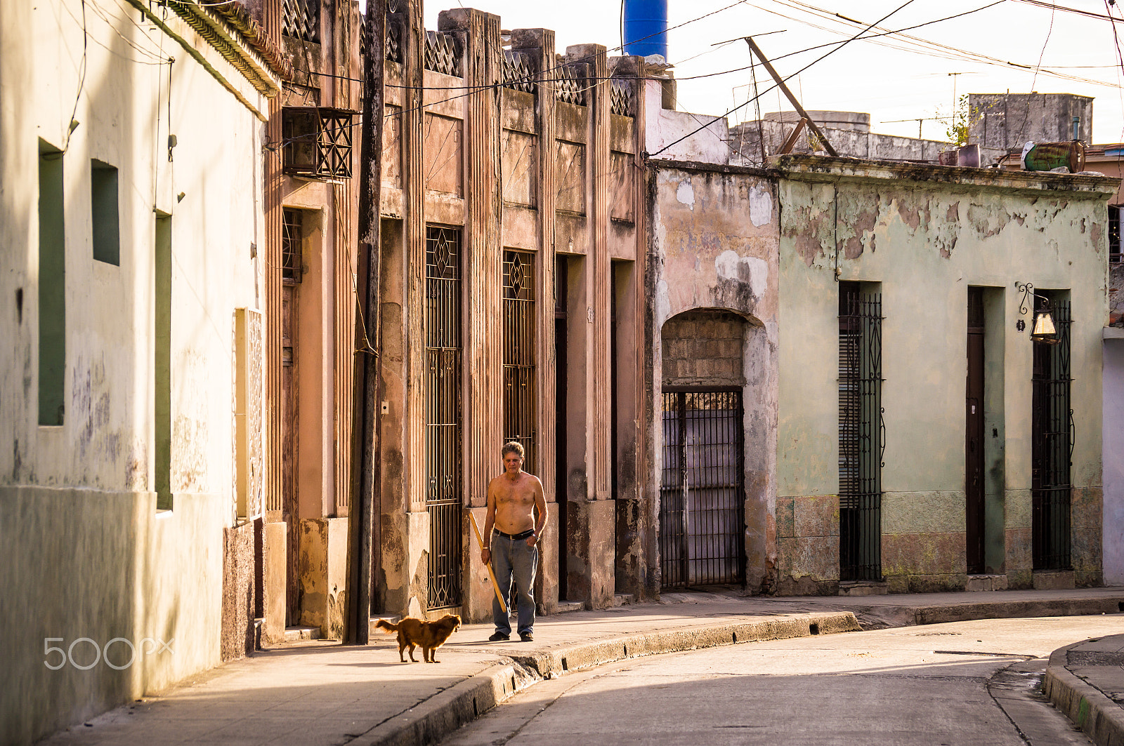 Sony DT 18-135mm F3.5-5.6 SAM sample photo. Man with dog in camaguey photography