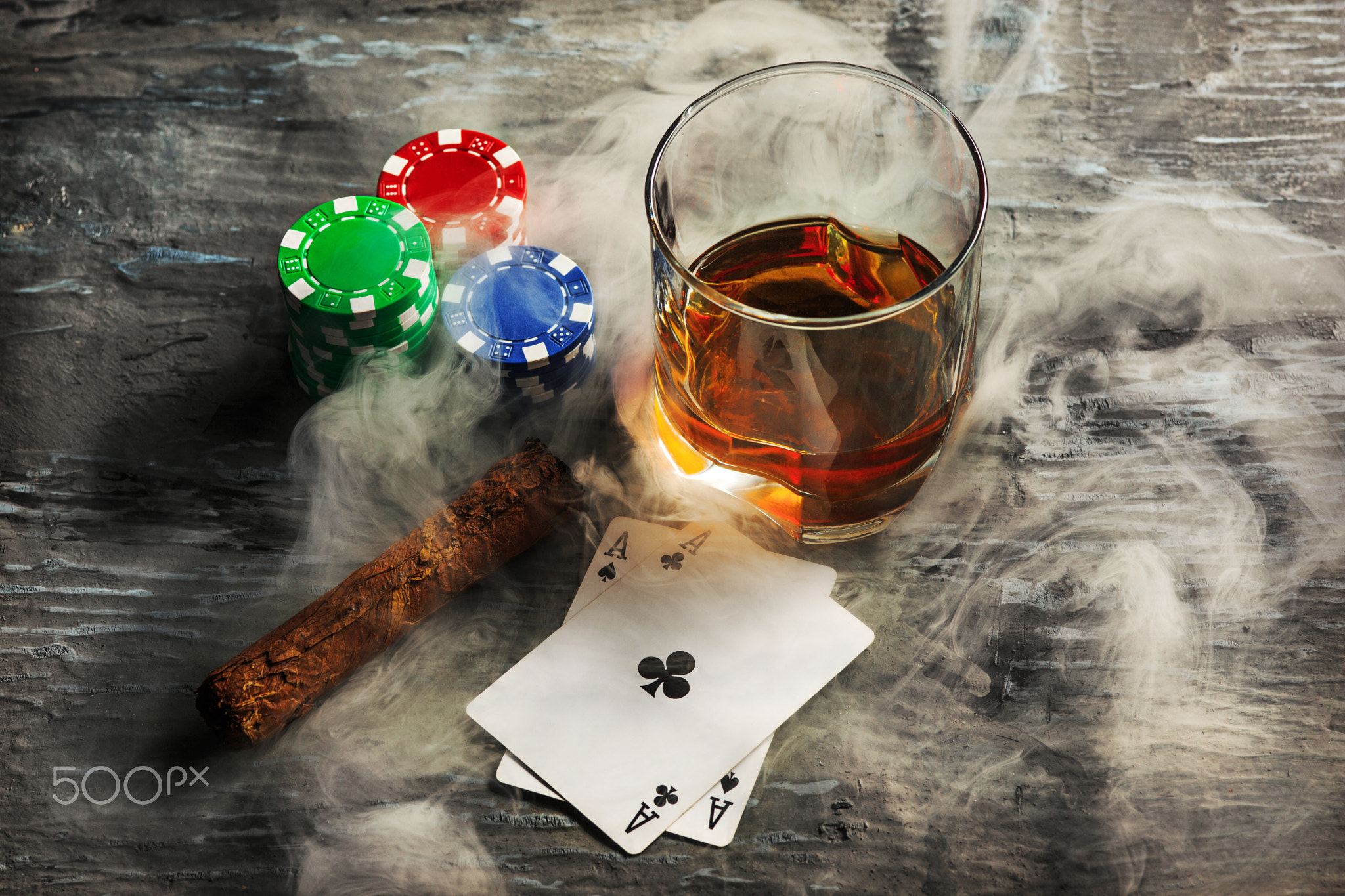 Cigar, chips for gamblings, drink and playing cards