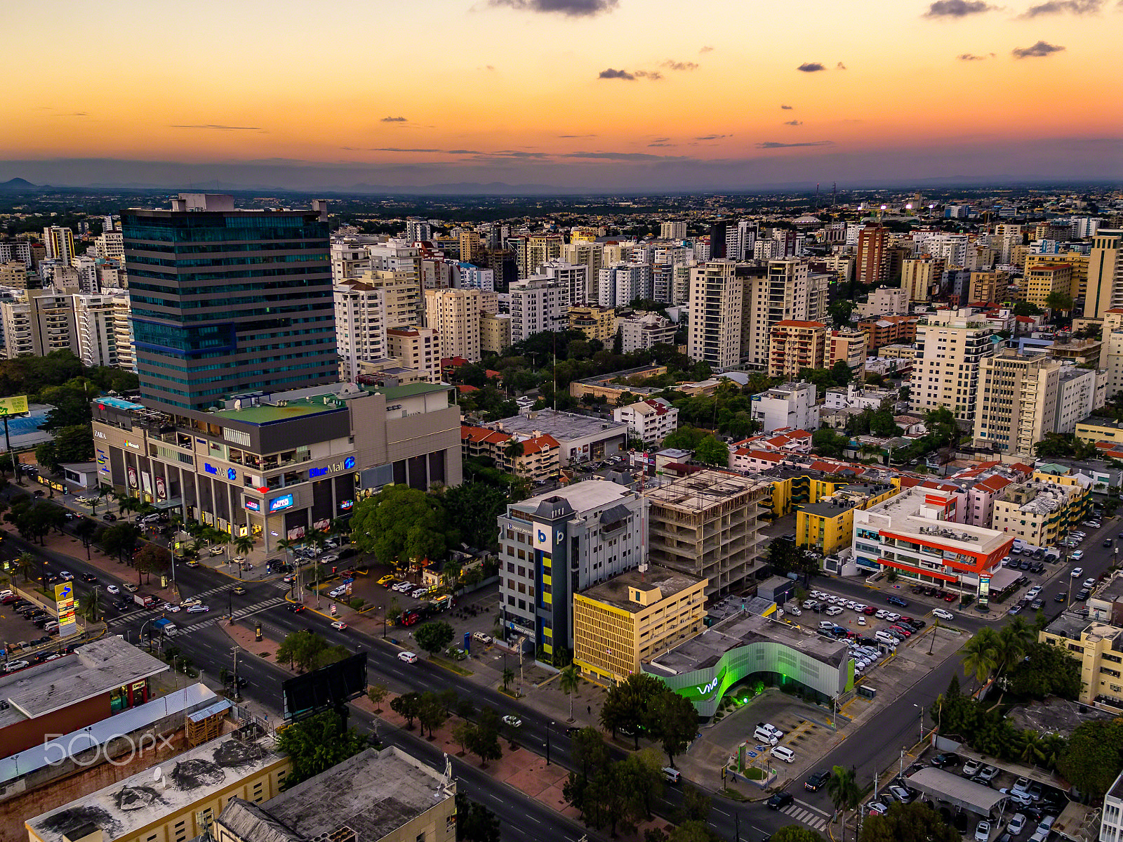 DJI MFT 15mm F1.7 ASPH sample photo. Sunset over downtown santo domingo photography