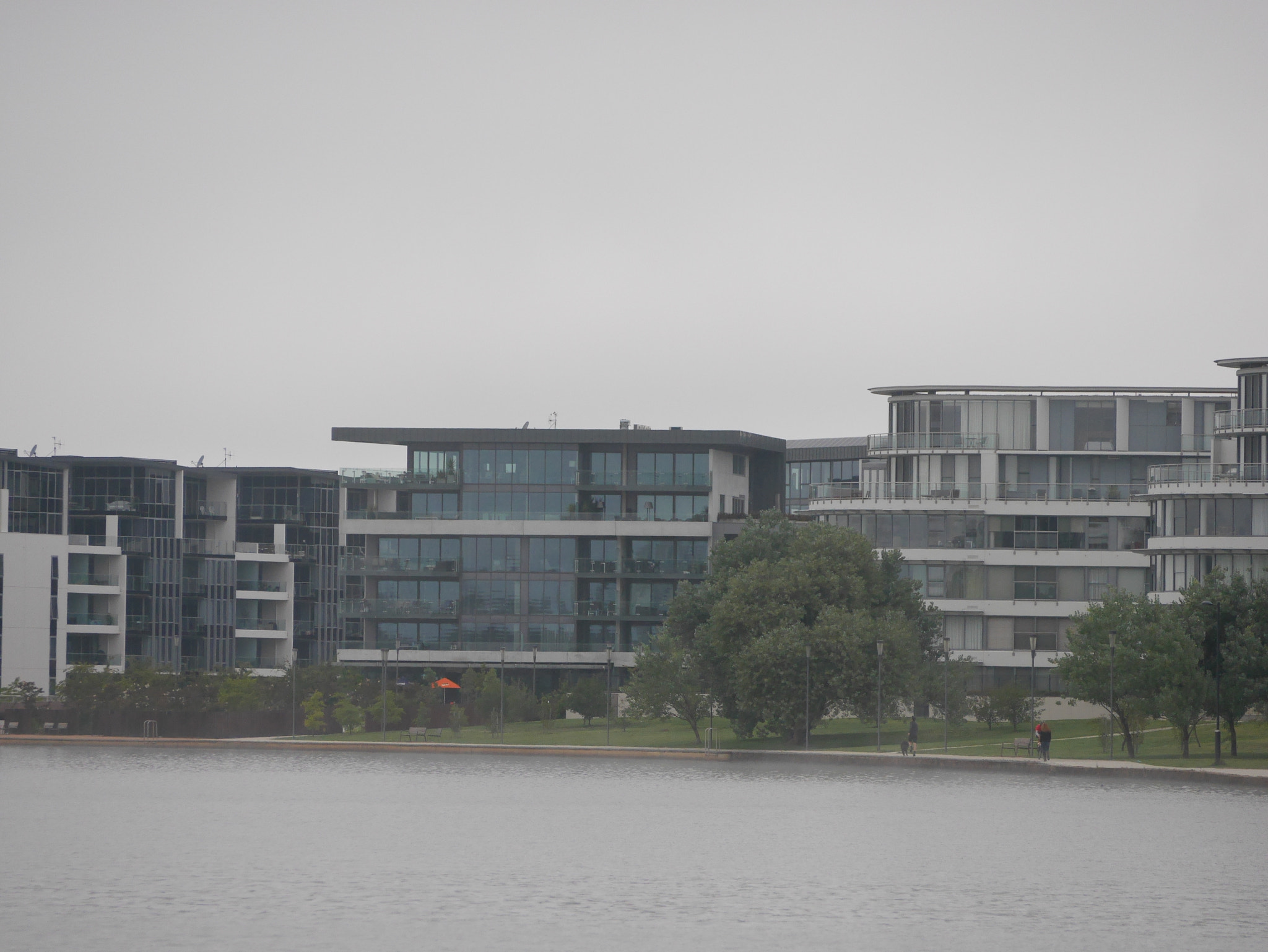 Panasonic DMC-GM1S sample photo. Buildings across the lake through fog - australian autumn 2017, kingston foreshore,act, australia photography