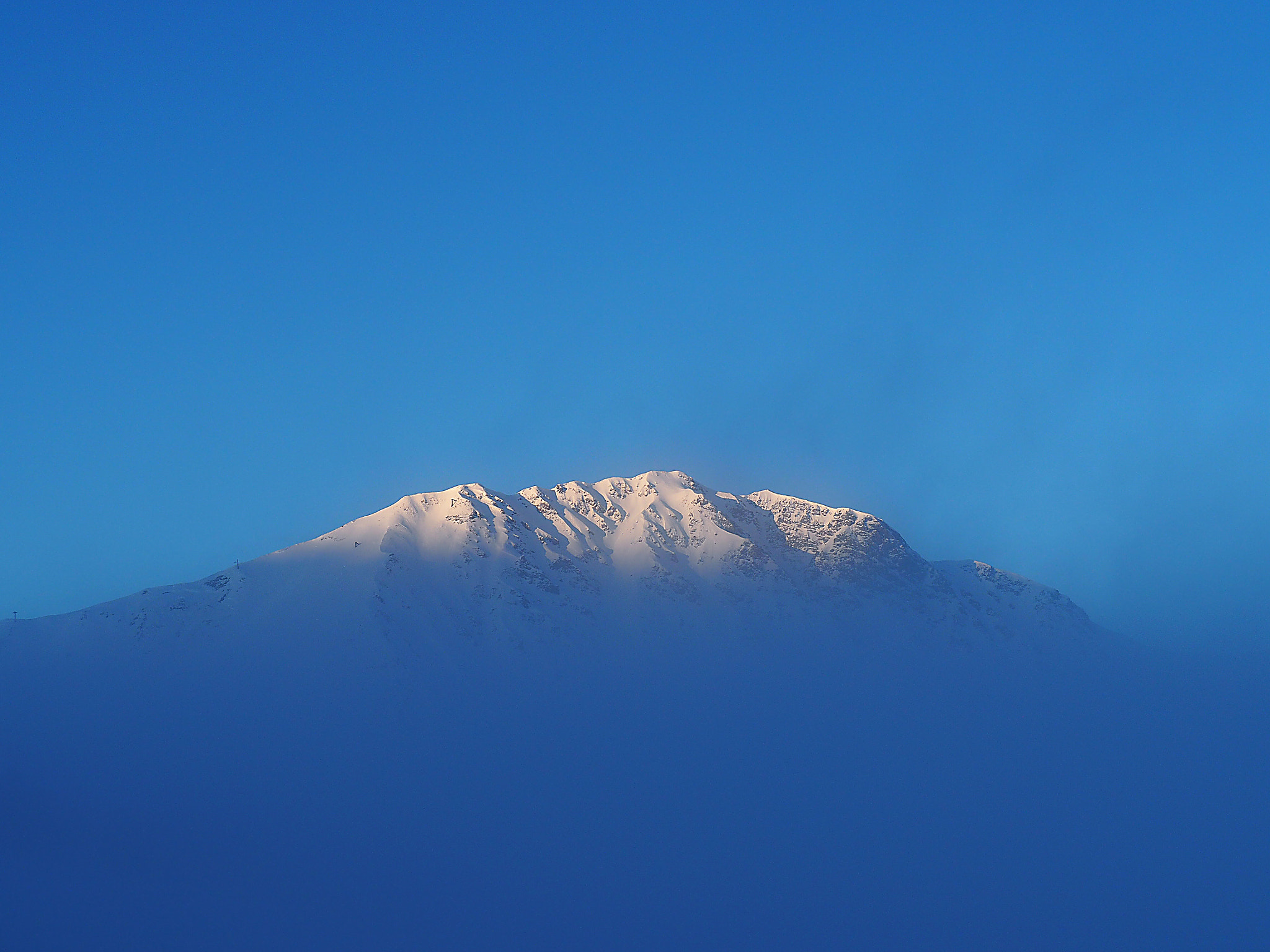 Olympus OM-D E-M10 sample photo. First sun on a foggy mountain photography