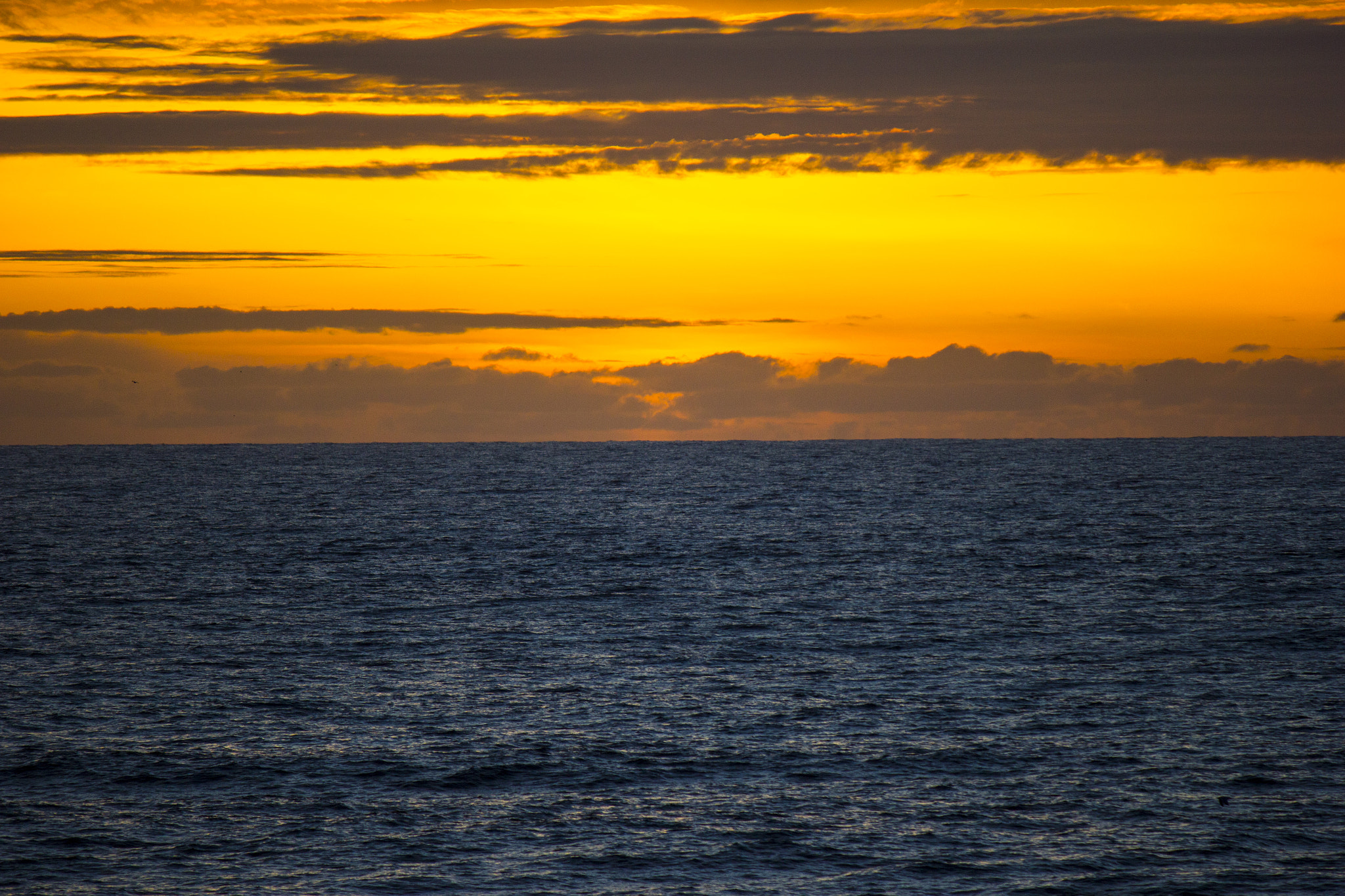 Canon EF-S 55-250mm F4-5.6 IS sample photo. Ocean sunset with dramatic colors photography