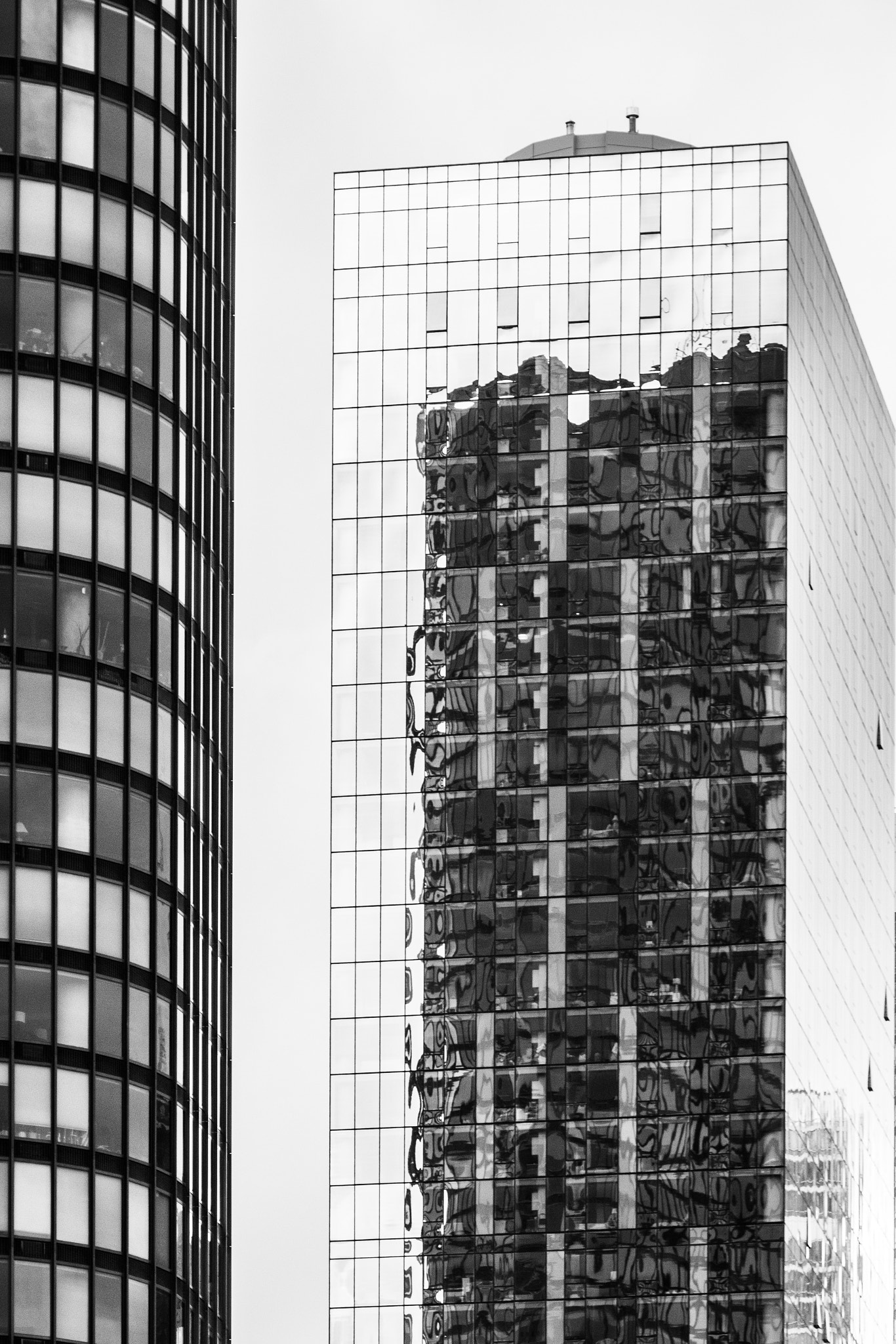 Sony a7R + Sony FE 24-240mm F3.5-6.3 OSS sample photo. Reflection on a building photography