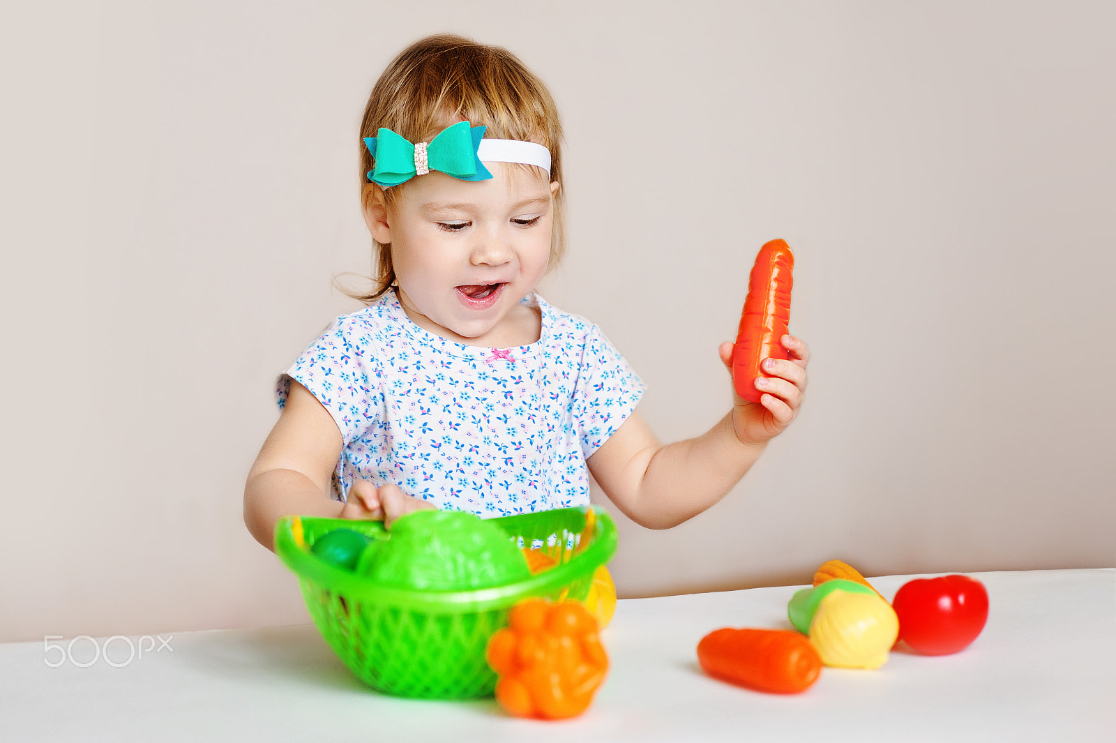 Nikon D700 + Nikon AF Nikkor 85mm F1.8D sample photo. Little girl playing indoors at home or kindergarten. adorable smiling little child cutting... photography