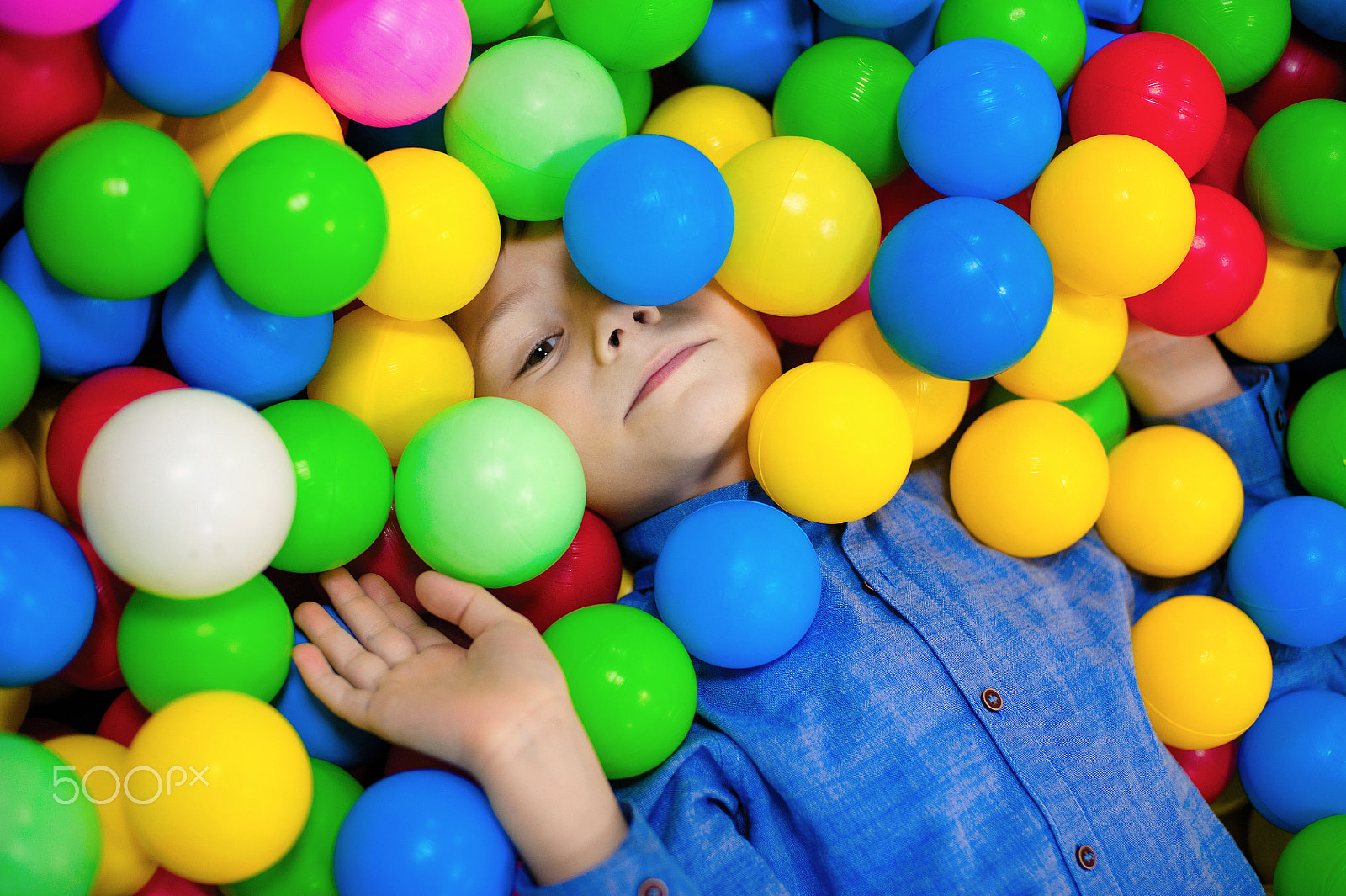 Nikon D700 + Nikon AF Nikkor 50mm F1.4D sample photo. Happy little kid boy playing at colorful plastic balls playground high view. funny child having... photography
