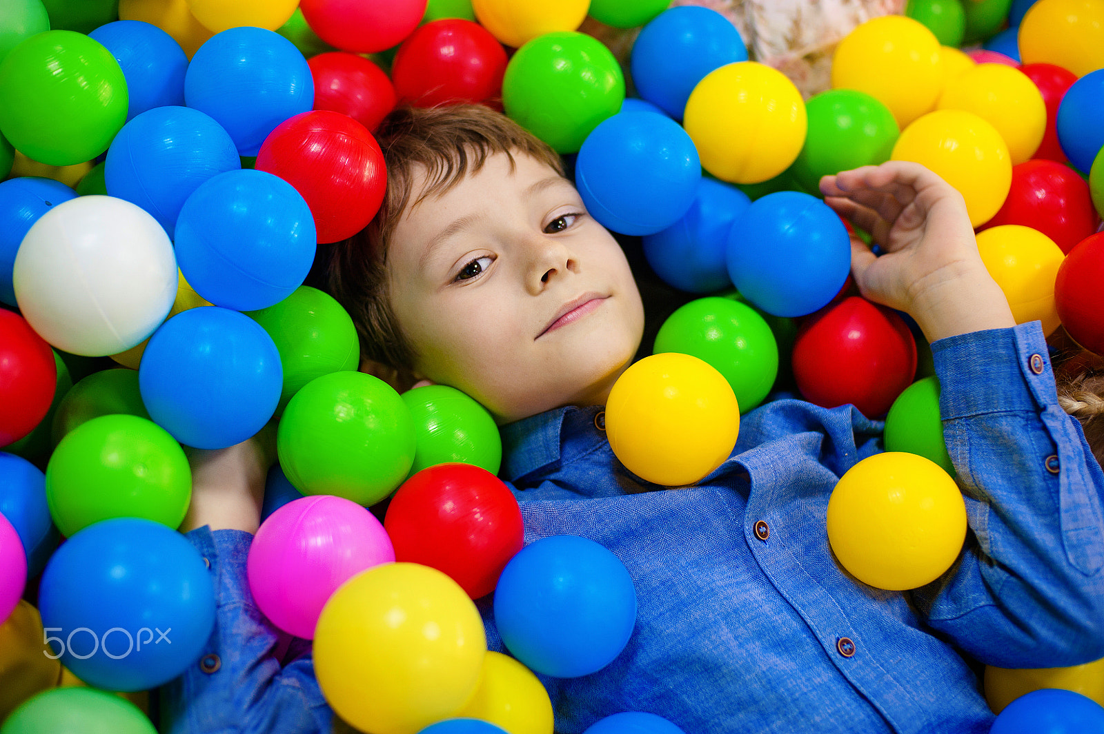 Nikon D700 + Nikon AF Nikkor 50mm F1.4D sample photo. Happy boy having fun in ball pit on birthday party in kids amusement park and indoor play center.... photography