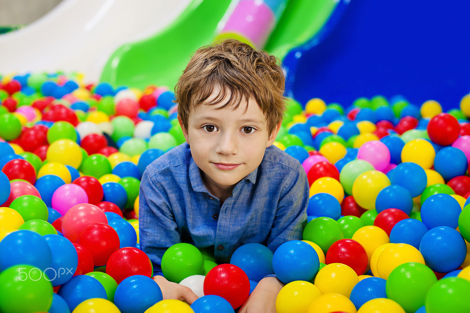 Nikon D700 + Nikon AF Nikkor 50mm F1.4D sample photo. Young boy having fun playing with colorful plastic balls. photography