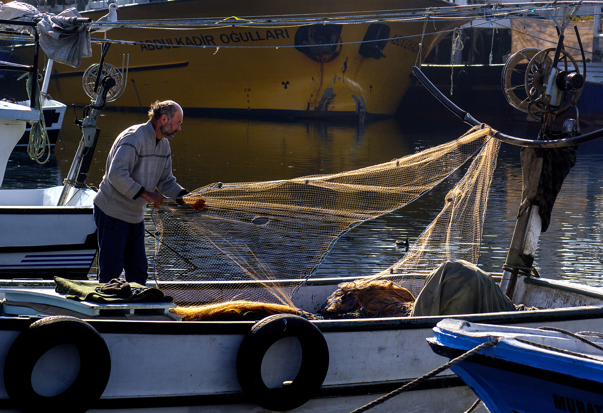Canon EOS 60D + EF75-300mm f/4-5.6 sample photo. Fisherman photography