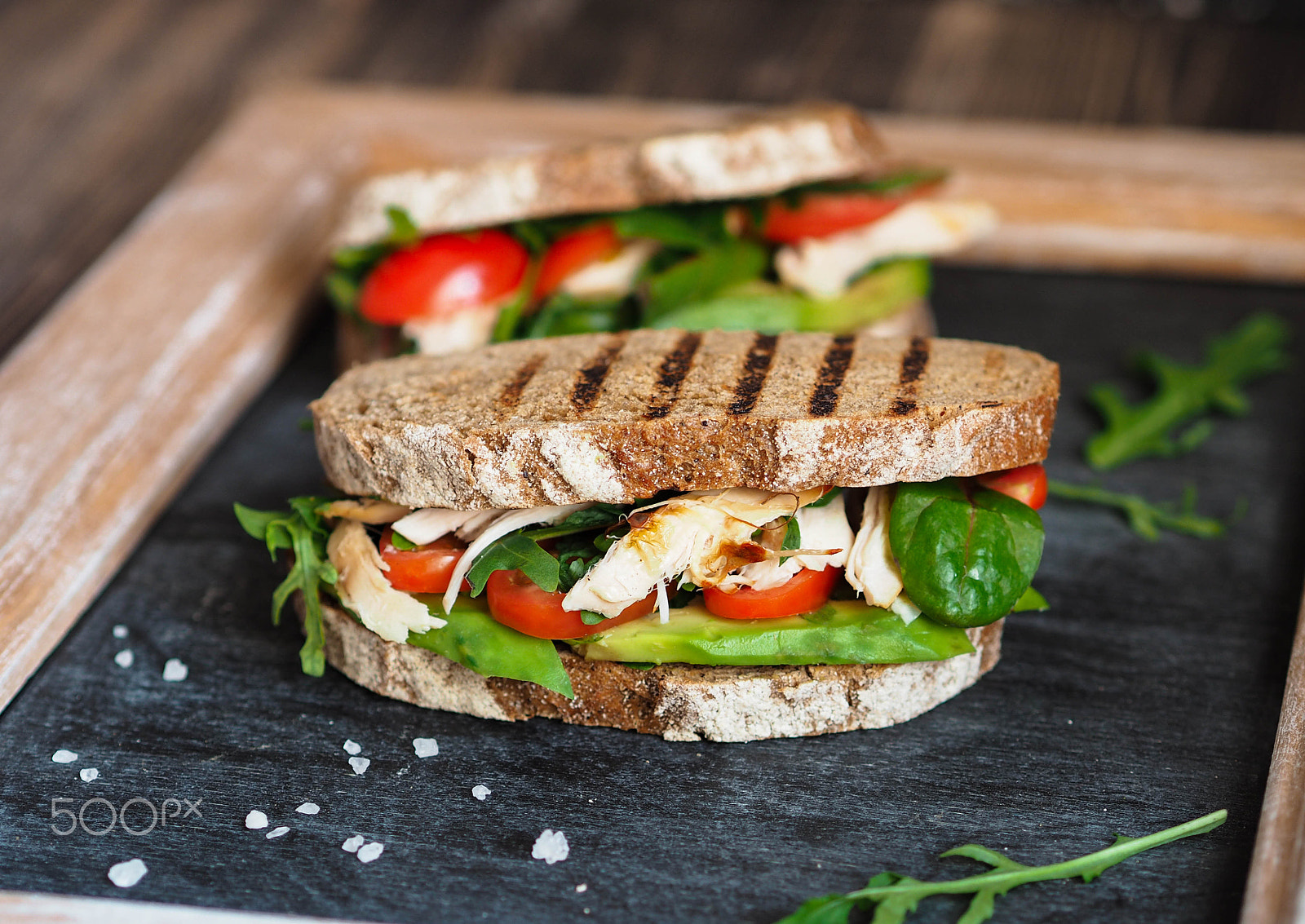 Olympus OM-D E-M10 sample photo. Homemade sandwich with avocado, arugula, tomatoes photography