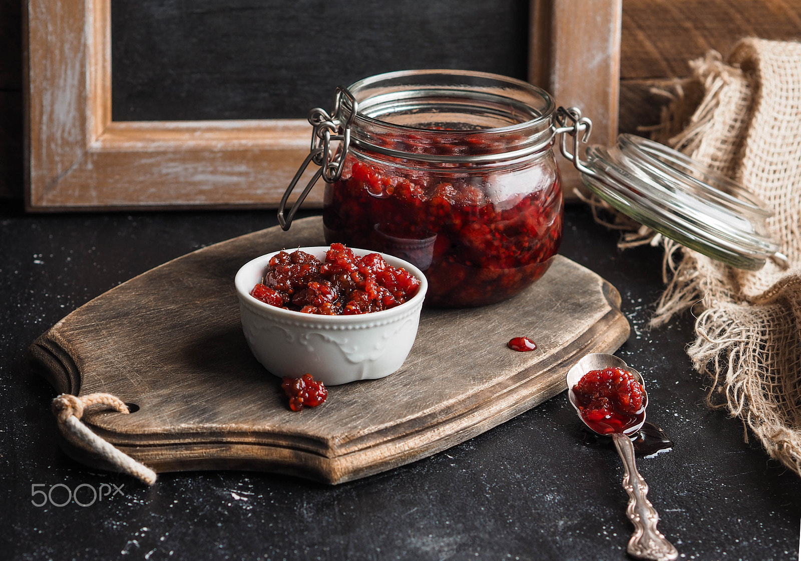 Olympus OM-D E-M10 + Olympus M.Zuiko Digital 45mm F1.8 sample photo. Homemade raspberry jam in a glass jar in a small b photography