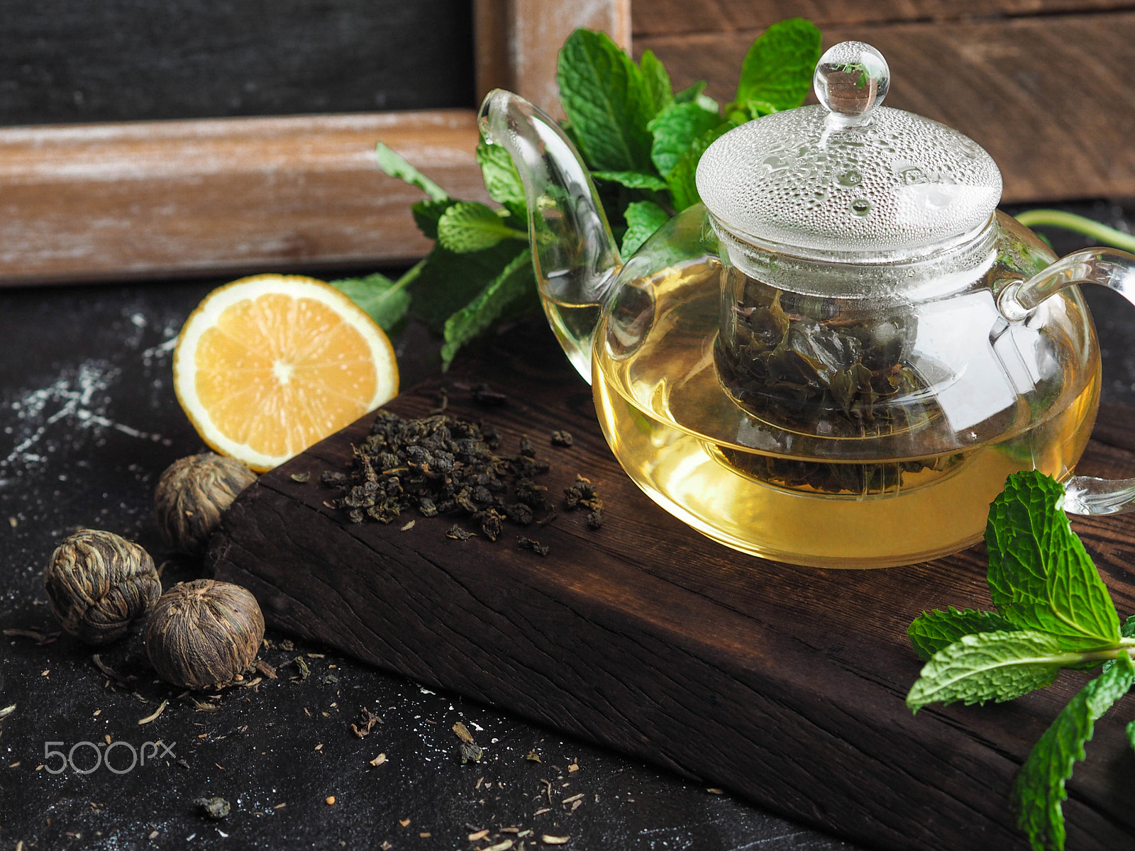 Olympus OM-D E-M10 sample photo. Freshly brewed green tea in a glass pot with lemon photography