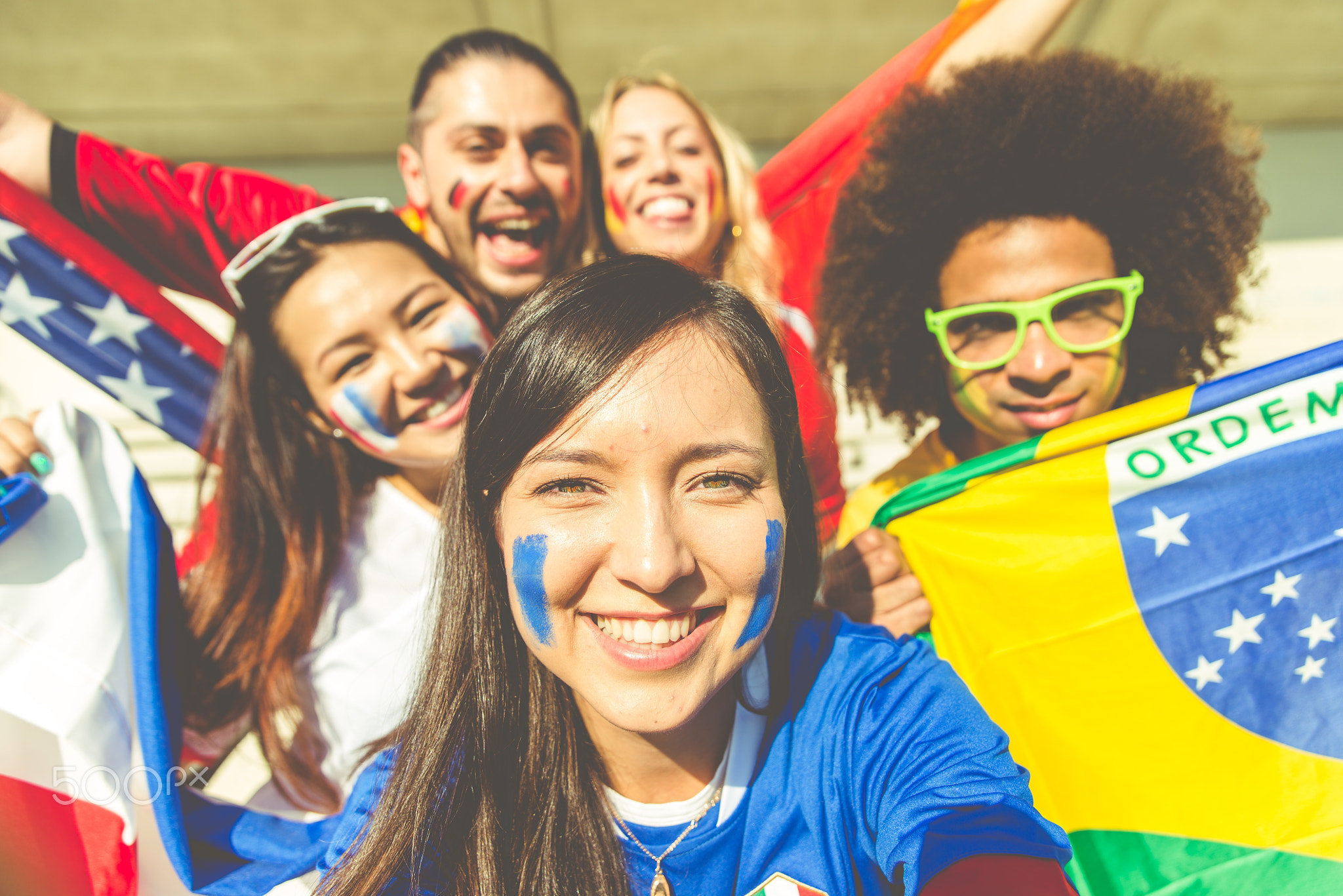 Group of mixed football fans taking selfie