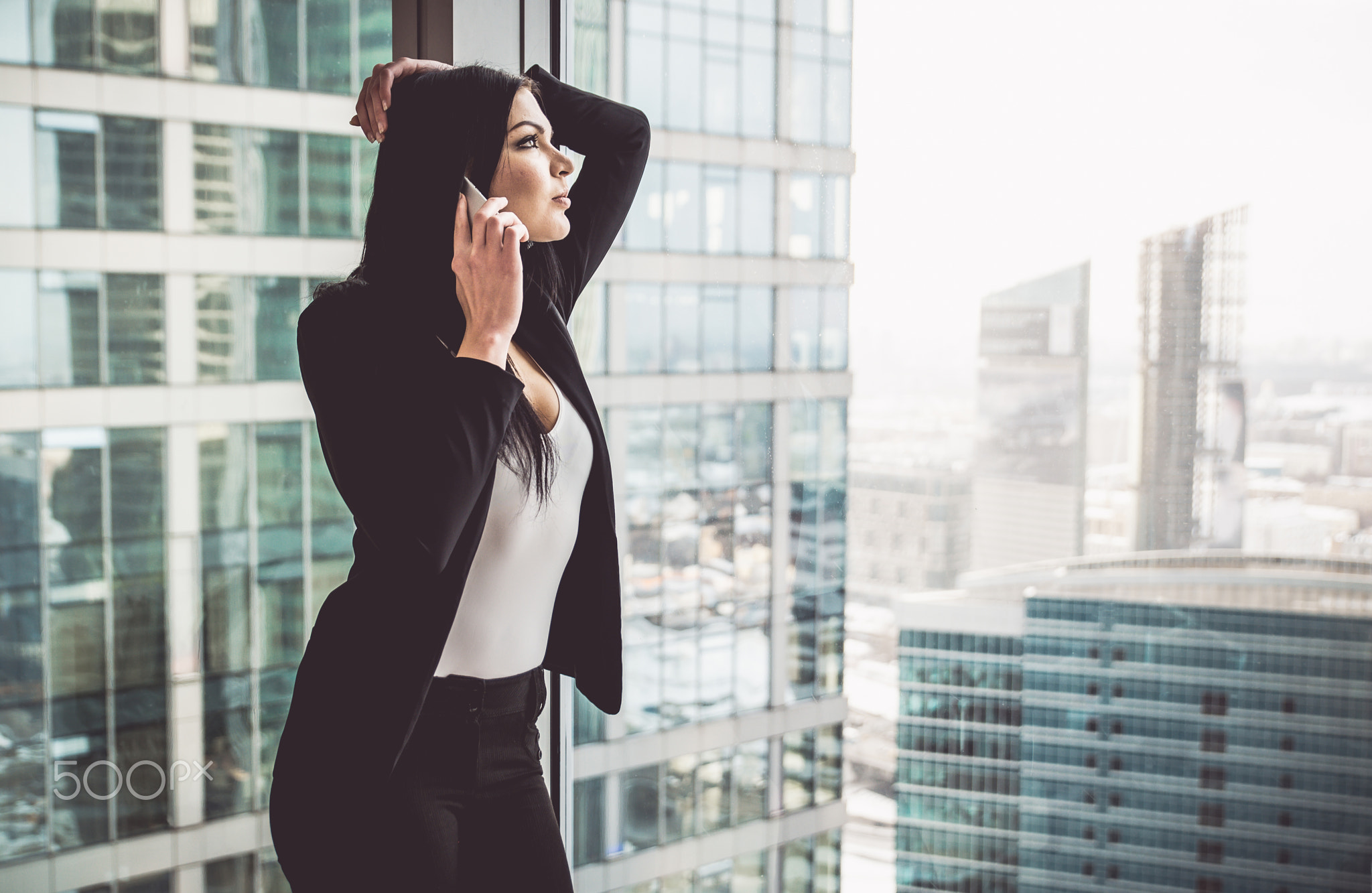 Business woman posing in her apartment