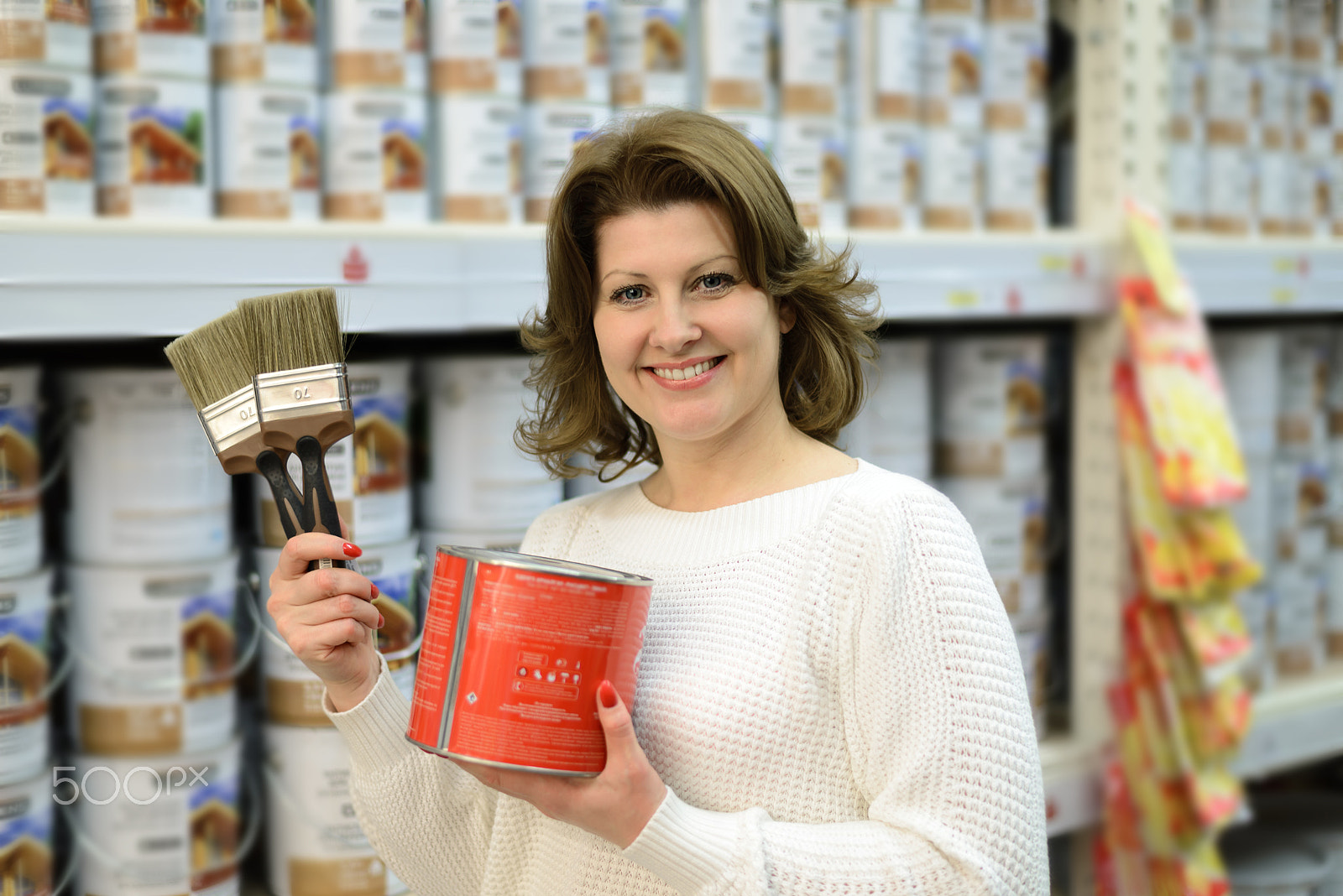 Nikon D600 + Nikon AF-S Nikkor 50mm F1.8G sample photo. Woman chooses paint and brushes in store photography