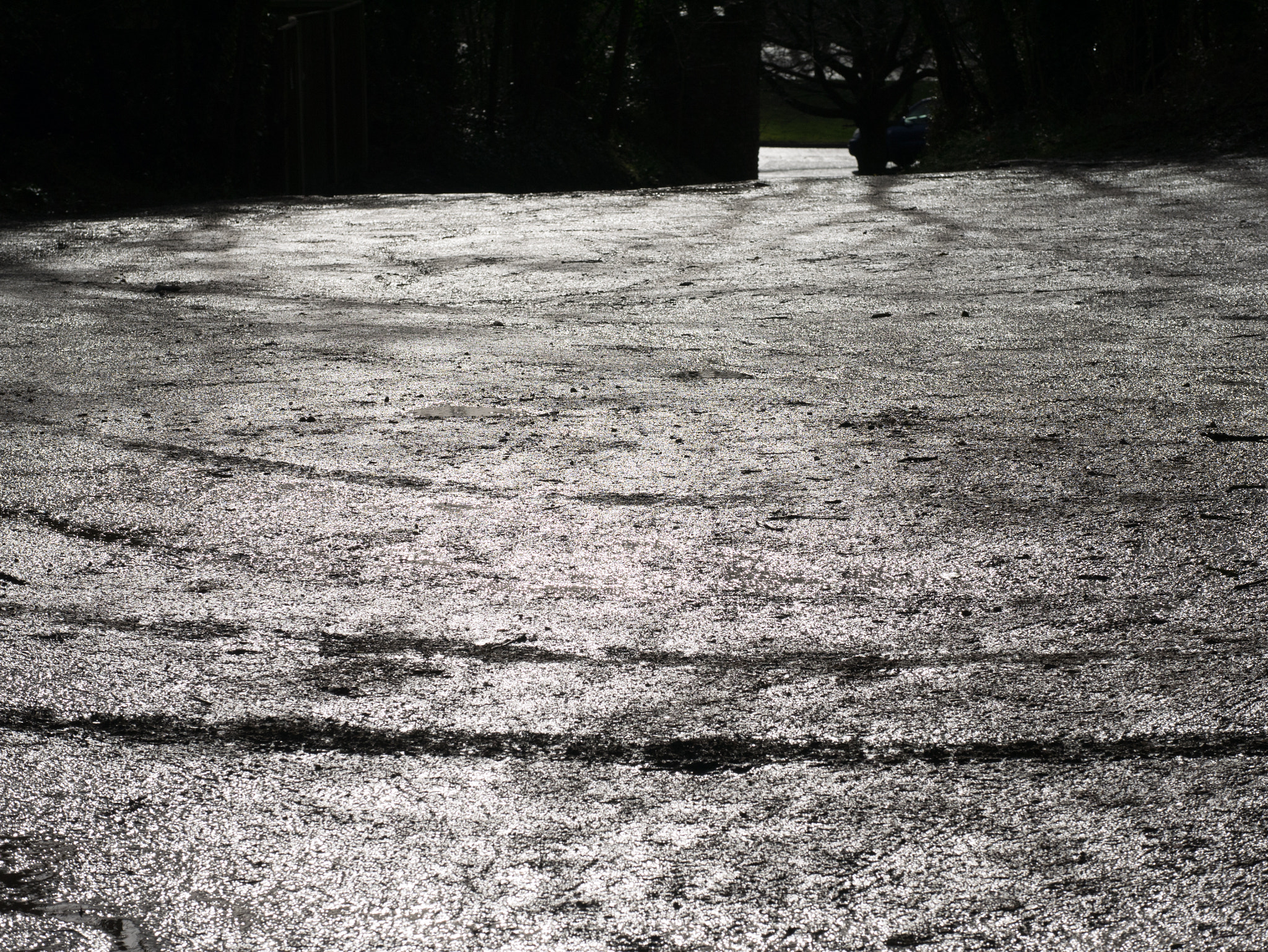 Panasonic Lumix DMC-GM1 sample photo. Muddy car park transformed by light photography