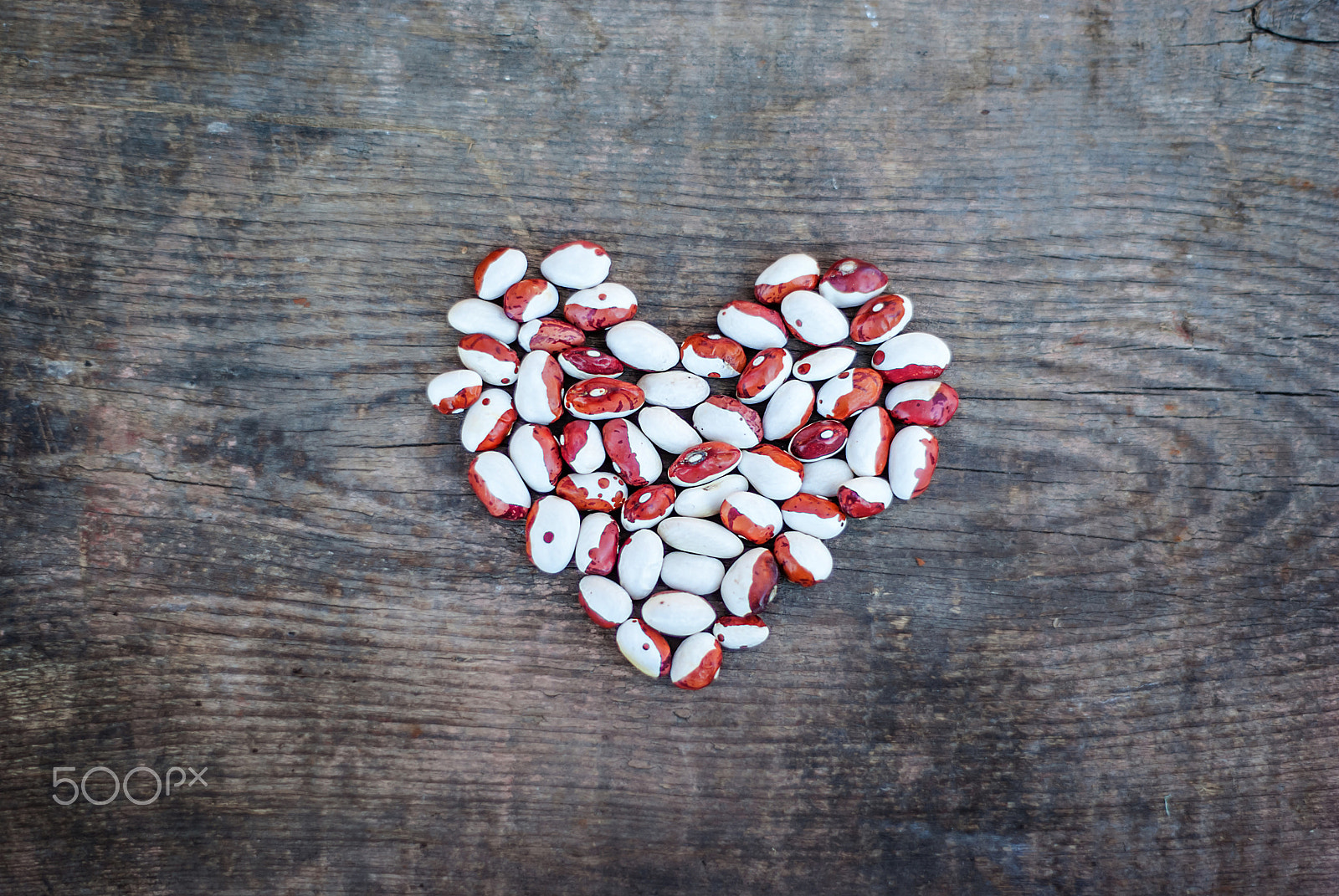 Pentax K10D sample photo. Bean heart on a wooden background photography