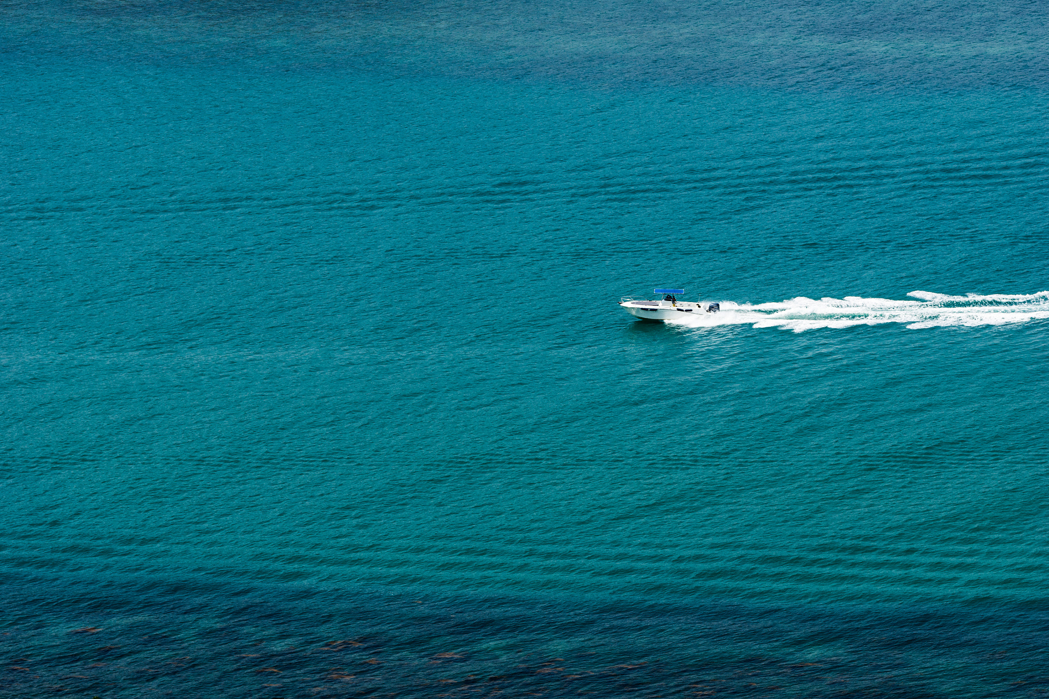 Sony SLT-A77 sample photo. Lonely speed boat photography