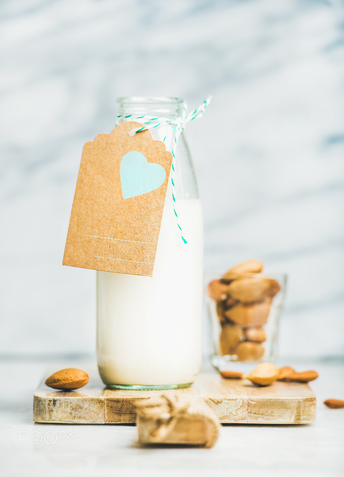 Nikon D610 sample photo. Fresh vegan dairy-free almond milk in bottle with craft label photography