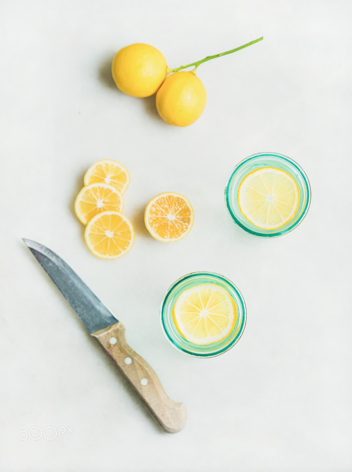 Nikon AF-S Nikkor 70-200mm F2.8G ED VR II sample photo. Morning detox lemon water in glasses, marble background, top view photography