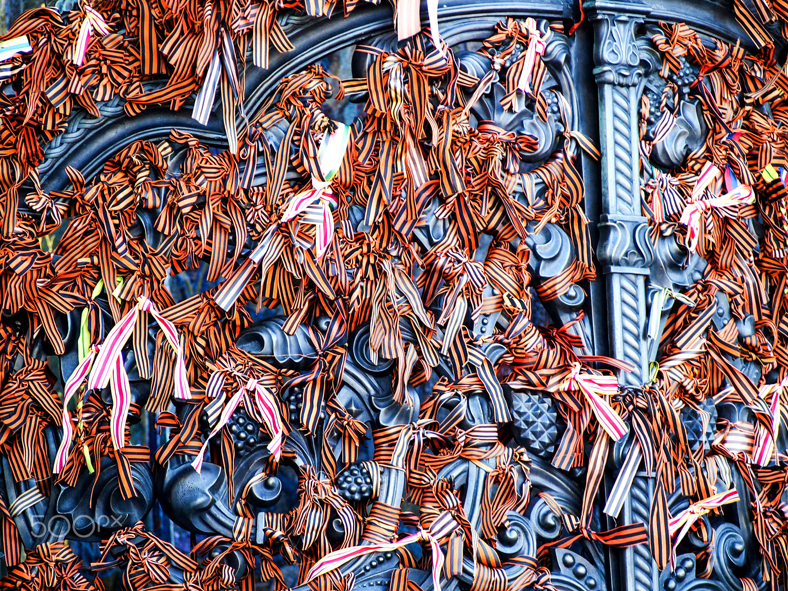 Olympus OM-D E-M5 sample photo. Orange ribbons tied to gate at kronstadt naval cathedral russia photography