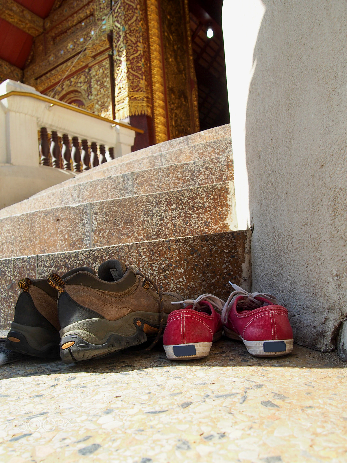 Olympus OM-D E-M5 + Olympus M.Zuiko Digital 14-42mm F3.5-5.6 II R sample photo. Shoes outside a temple in chiang mai thailand photography