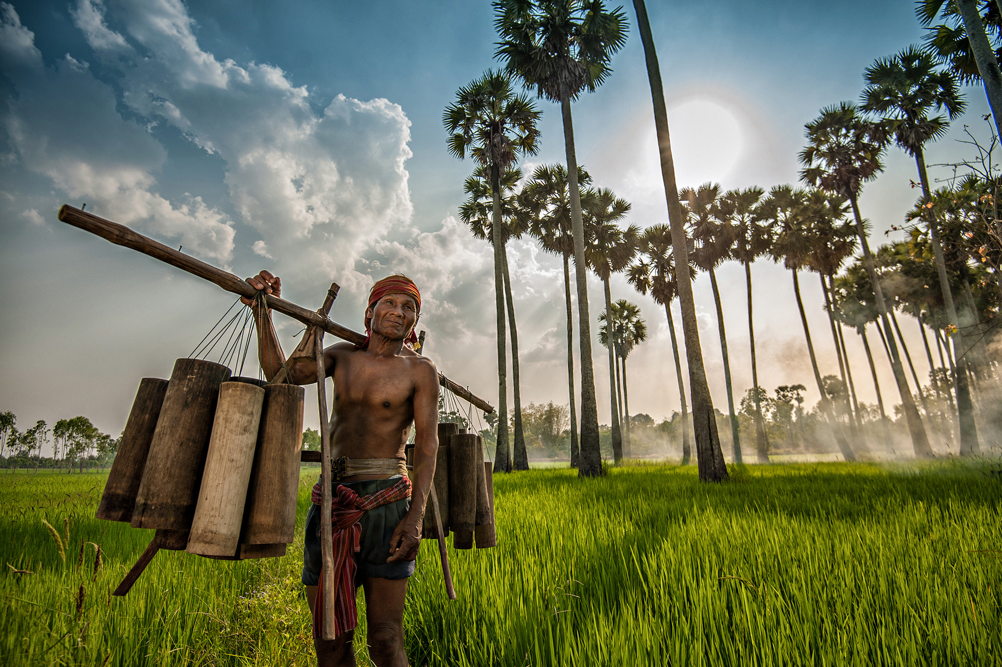 Nikon AF-S Nikkor 16-35mm F4G ED VR sample photo. Happy farmer holder sugar collector in sugar palm tree field. photography