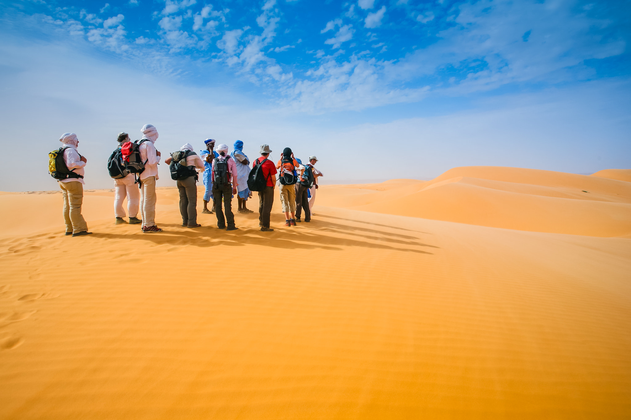 Canon EOS 5D + Canon EF 17-40mm F4L USM sample photo. Group of people walking in the desert photography