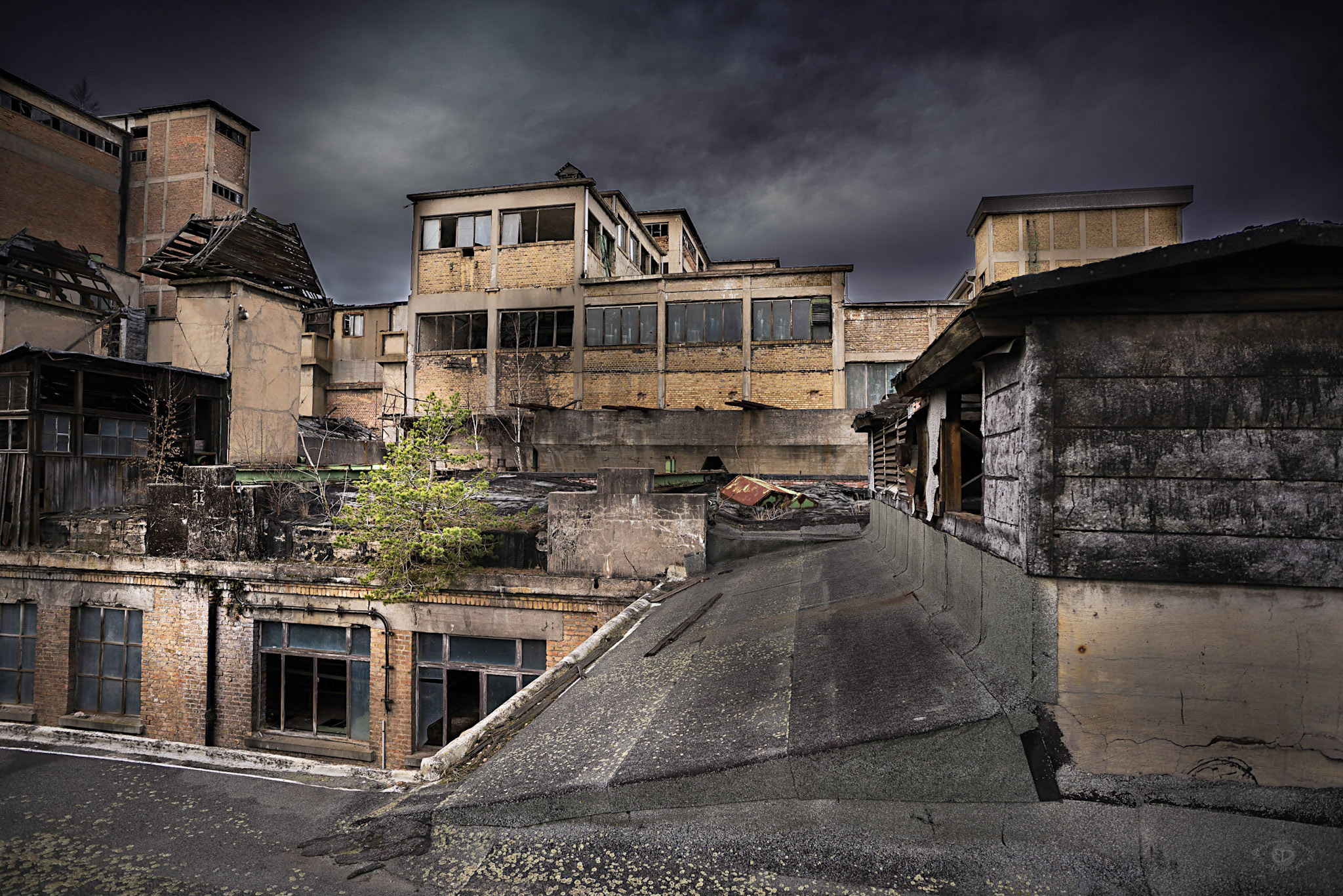 ZEISS Batis 18mm F2.8 sample photo. Dark clouds light abandoned building photography