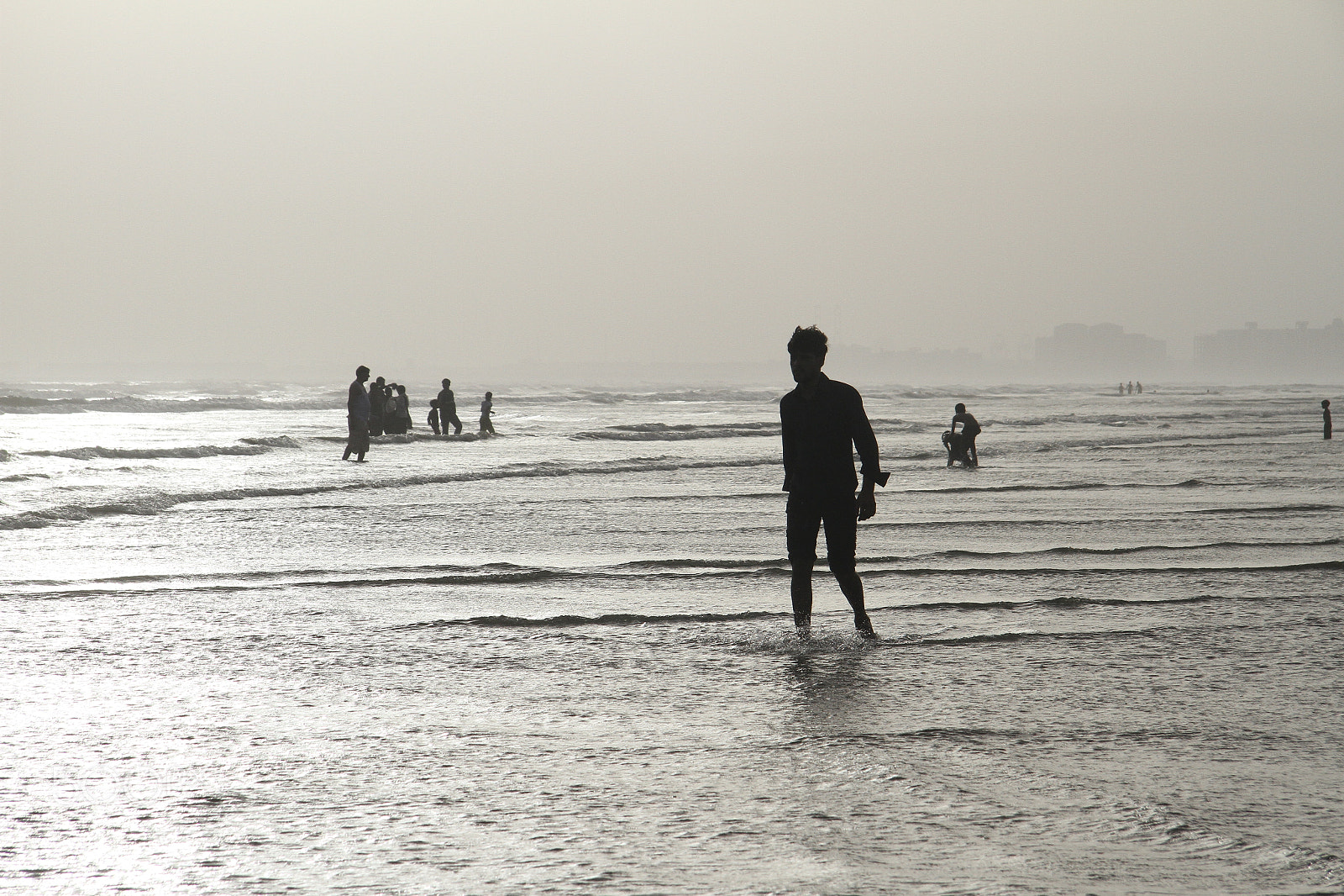 Canon EF-S 17-85mm F4-5.6 IS USM sample photo. Silhouettes wading at dusk photography